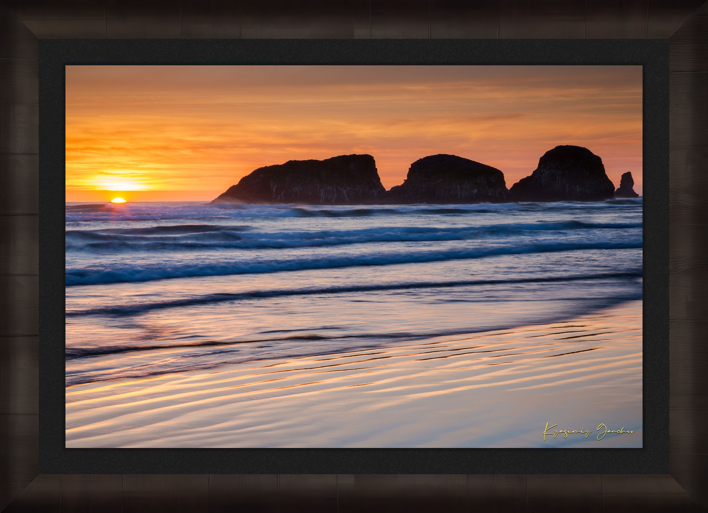 Bird Rock at Cannon Beach, Oregon, during sunset with reflections in the wet sand and ocean under cloudy skies. #Finish_Roma Dark Ash Frame & Dark Liner