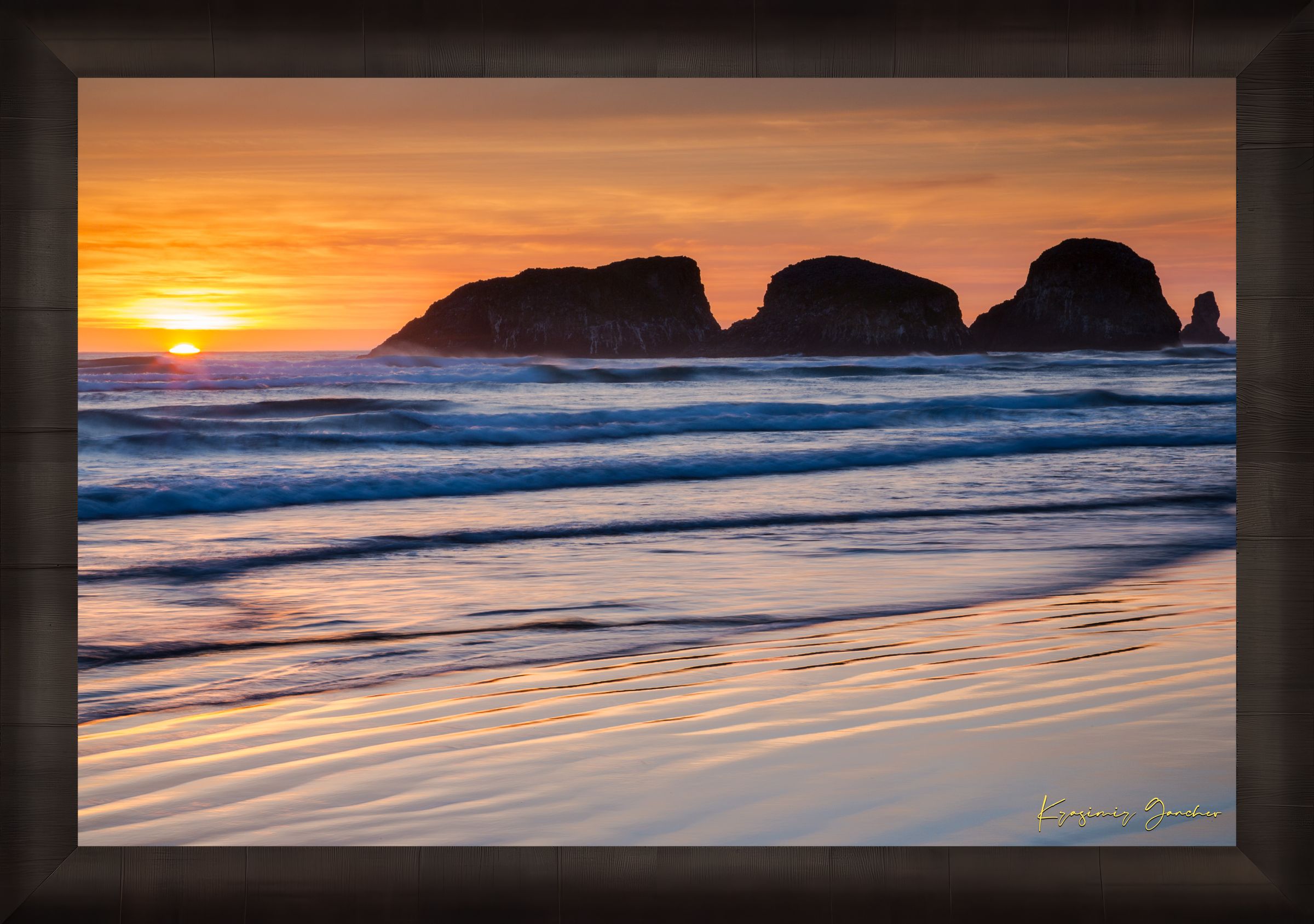 Bird Rock at Cannon Beach, Oregon, during sunset with reflections in the wet sand and ocean under cloudy skies. #Finish_Roma Dark Ash Frame