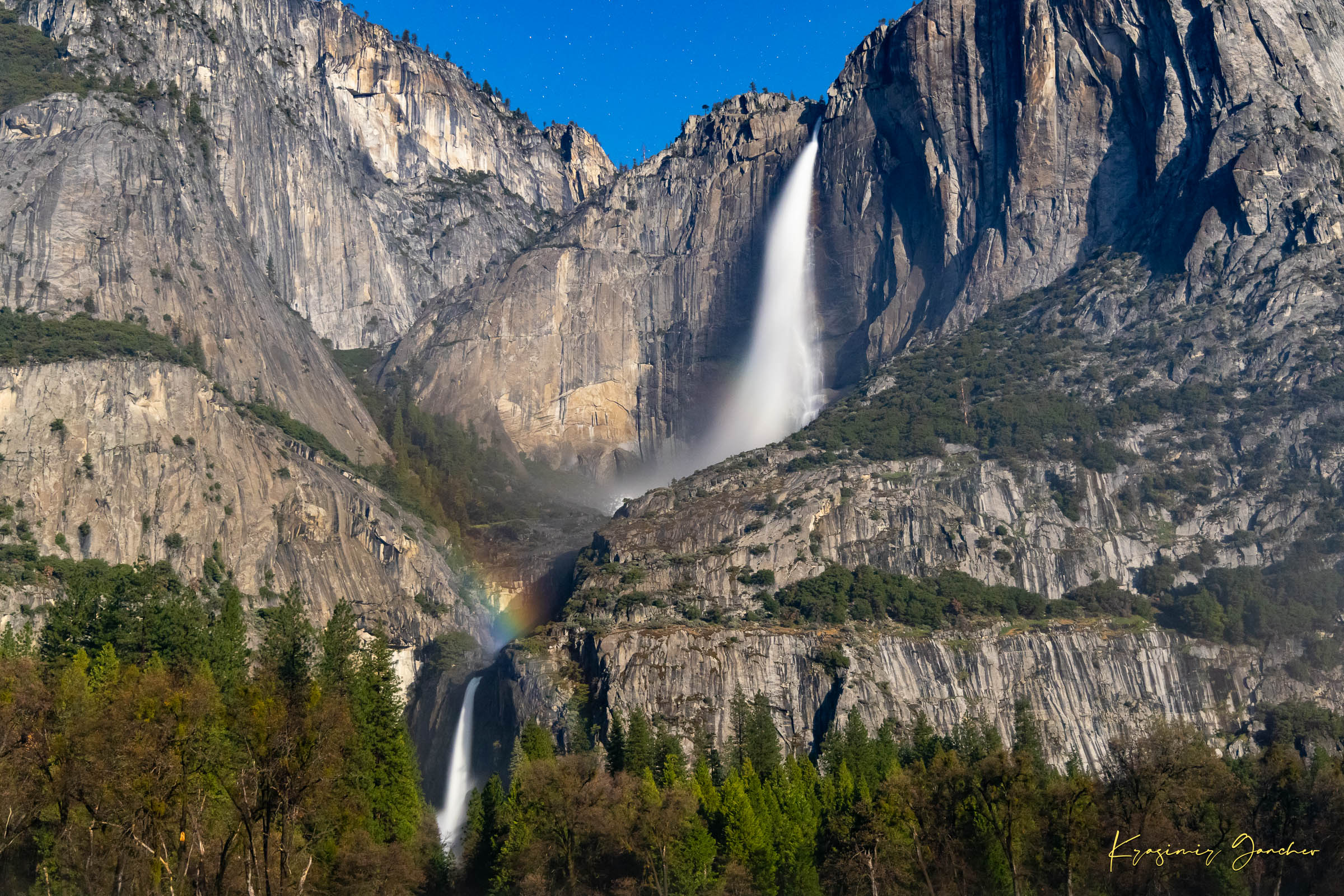 Yosemite Falls under starlight with a moonbow forming in mist created by cascading water against granite cliffs. #Finish_Acrylic Recess