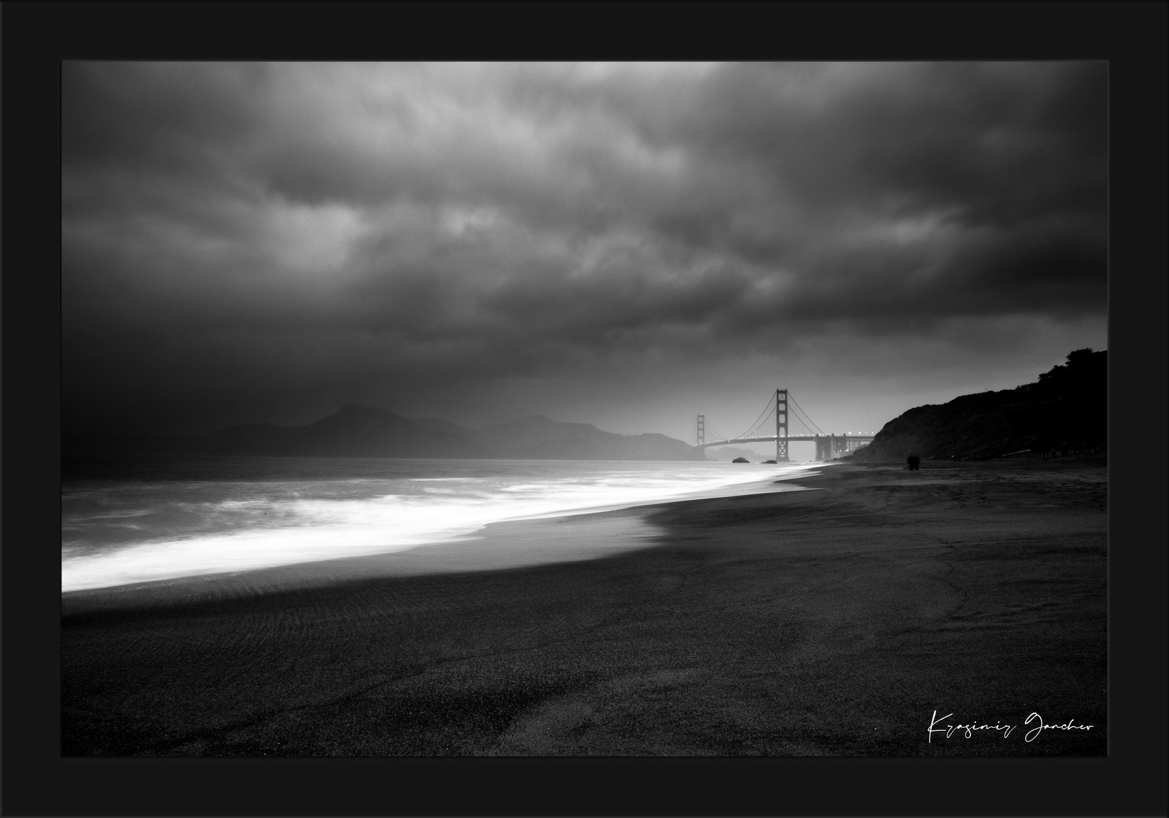 Golden Gate Bridge silhouette visible through thick clouds and fog over ocean near Baker Beach. #Finish_Roma Satin Black Frame