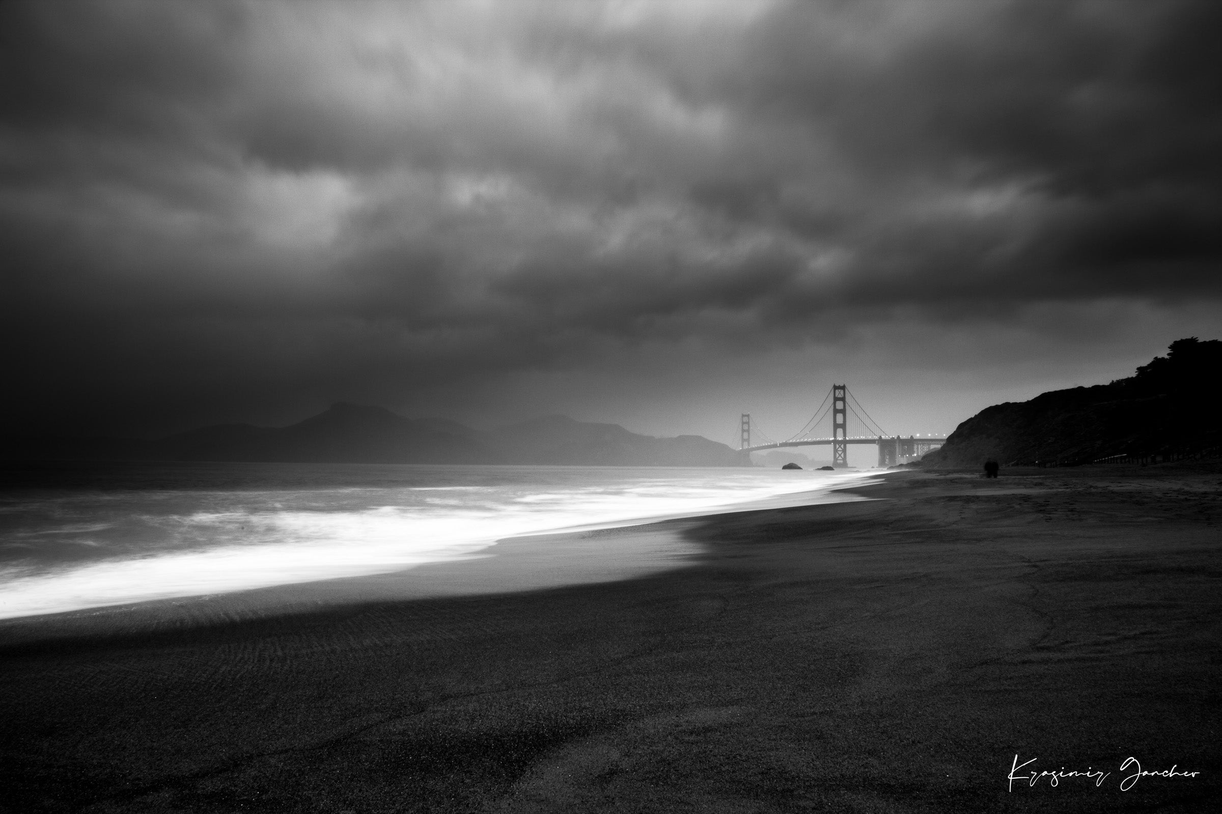 Golden Gate Bridge silhouette visible through thick clouds and fog over ocean near Baker Beach. #Finish_Acrylic Recess