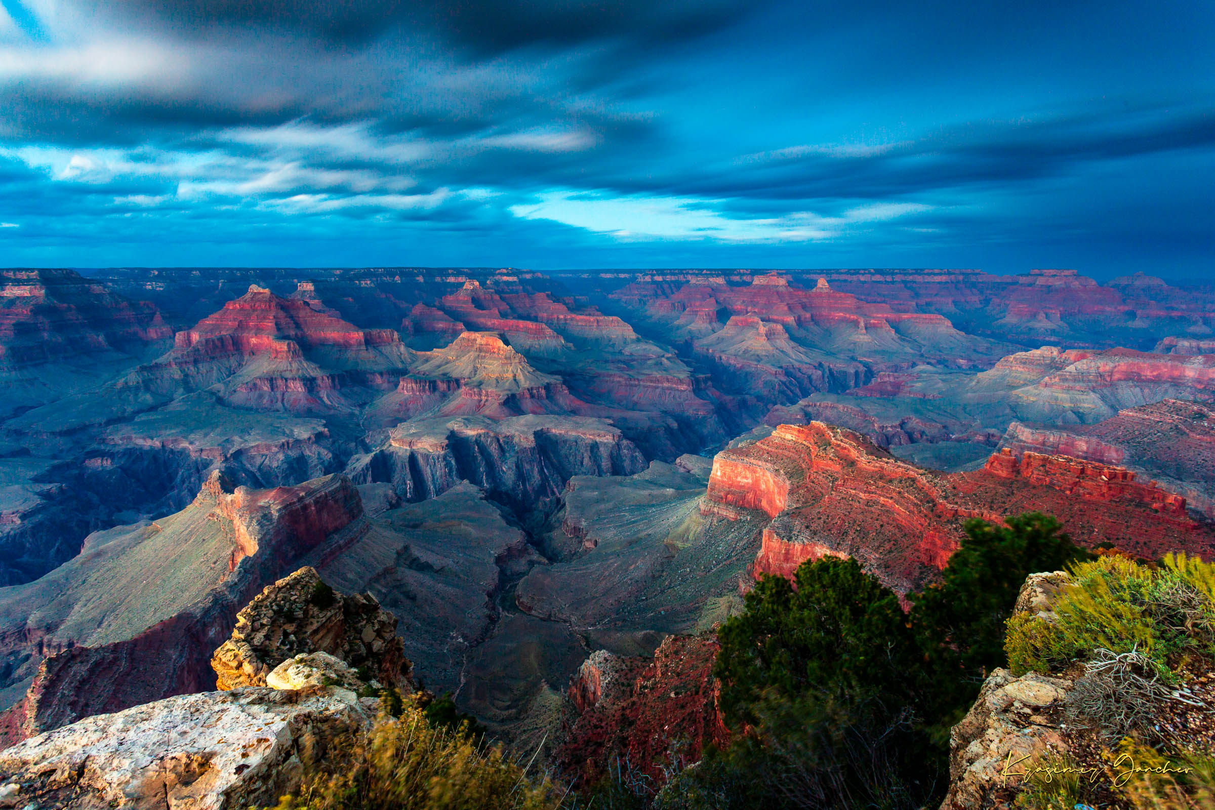 Grand Canyon under a dramatic sky at sunset, storm clouds gathering over the canyon rim during hazy weather. #Finish_Acrylic Recess