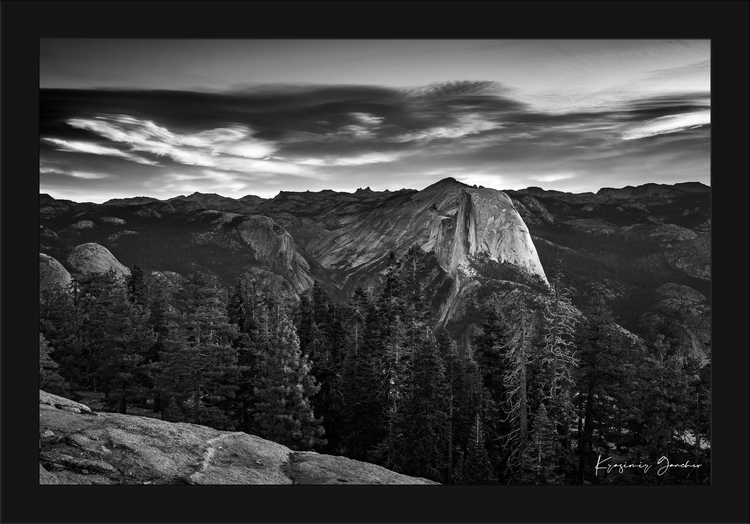 Half Dome monolith during sunrise in Yosemite National Park, dramatic clouds and stark tones. #Finish_Roma Satin Black Frame