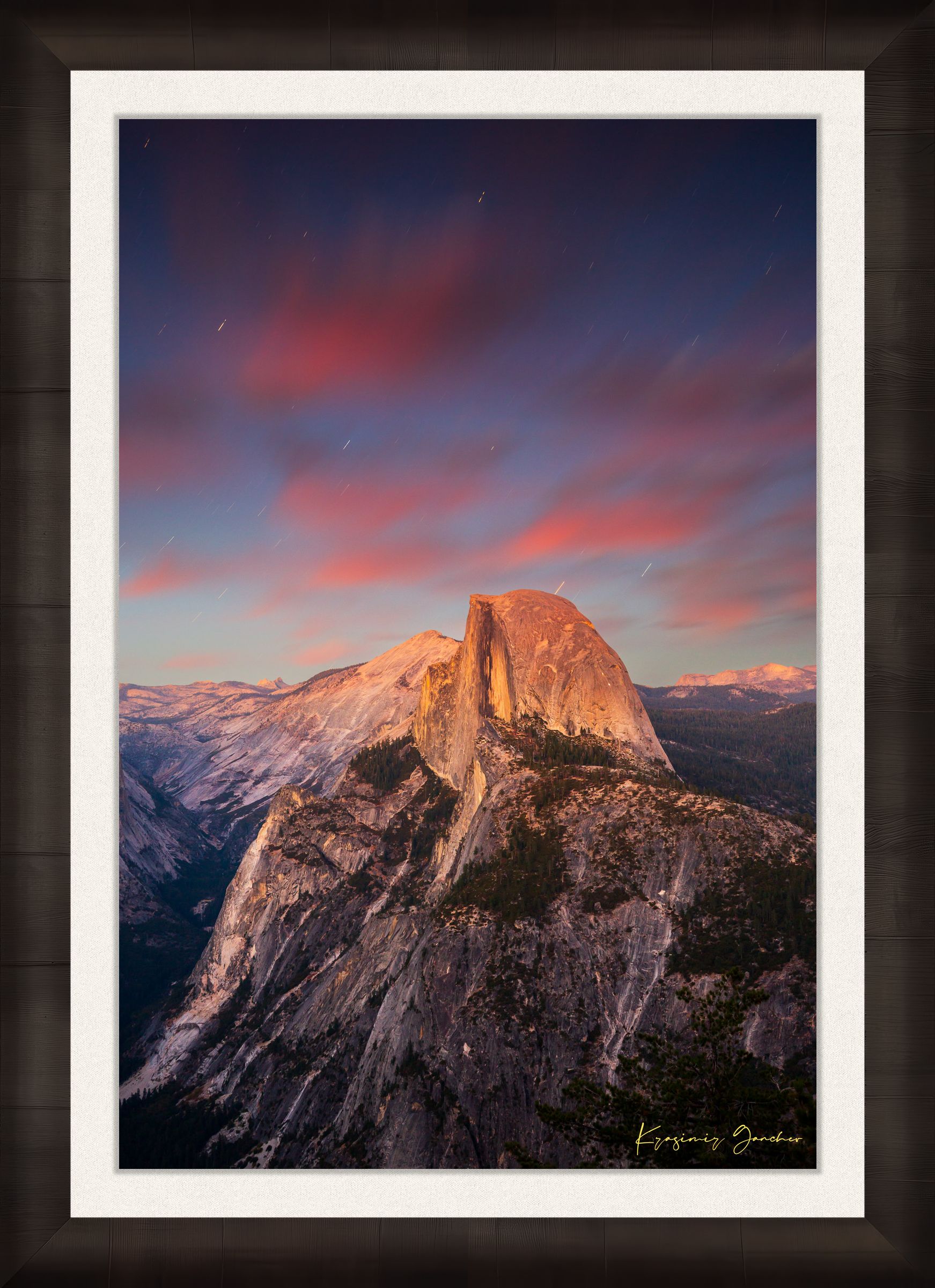 Granite monolith of Half Dome illuminated by dusk and stars, set against a sky filled with star trails above Yosemite National Park. #Finish_Roma Dark Ash Frame & Bright Liner