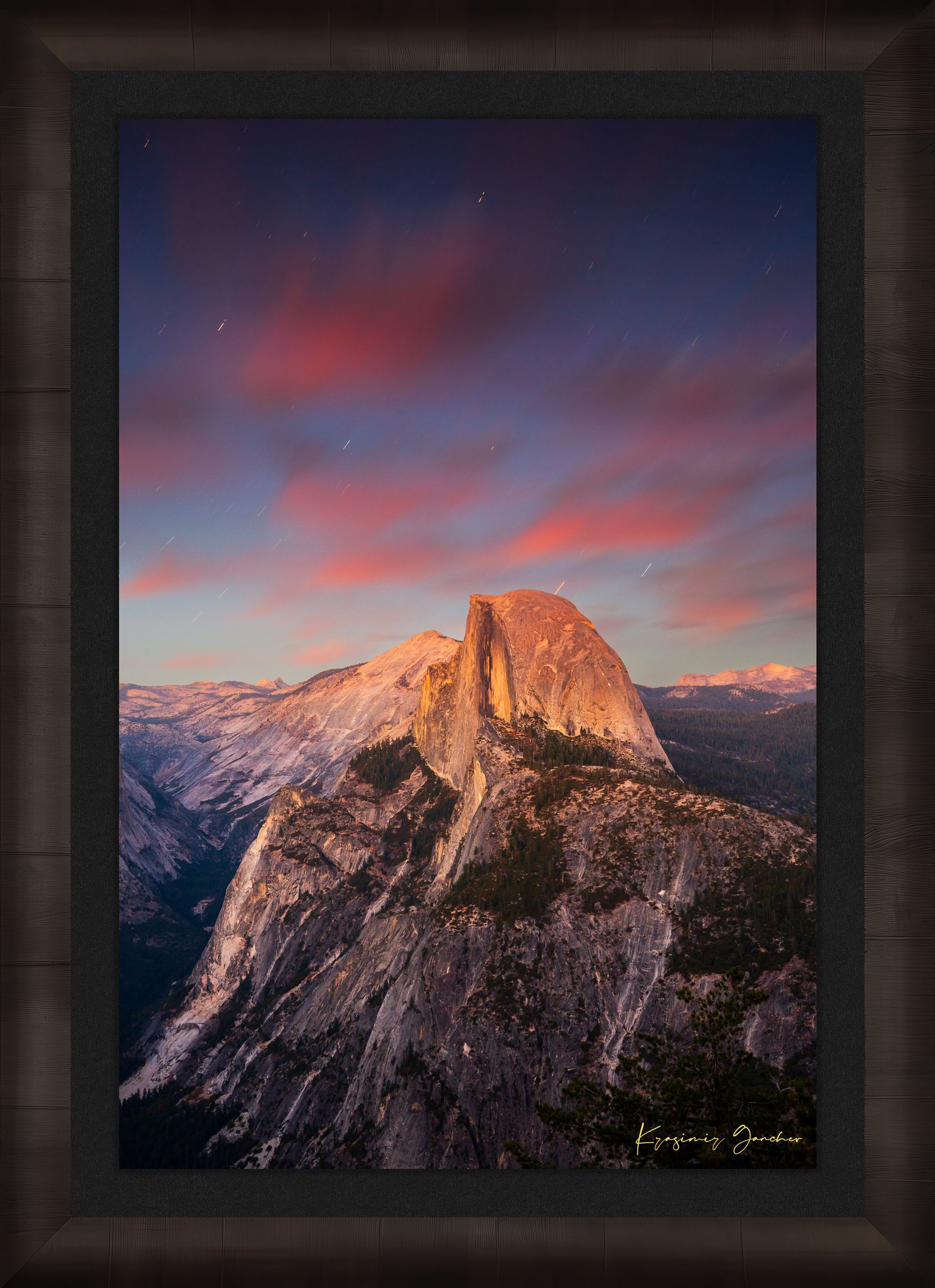 Granite monolith of Half Dome illuminated by dusk and stars, set against a sky filled with star trails above Yosemite National Park. #Finish_Roma Dark Ash Frame & Dark Liner
