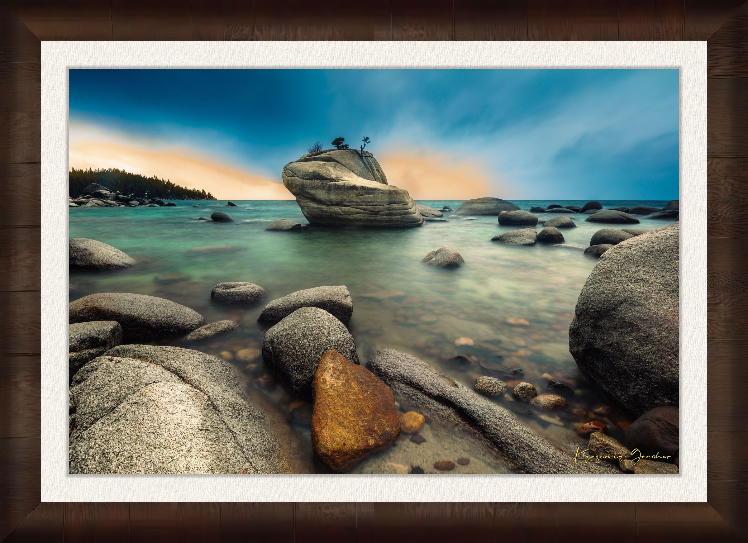 Bonsai Rock formation beside a calm lake in Lake Tahoe during sunset with gentle ripples and clouds. #Finish_Roma Cigar Leaf Frame & Bright Liner