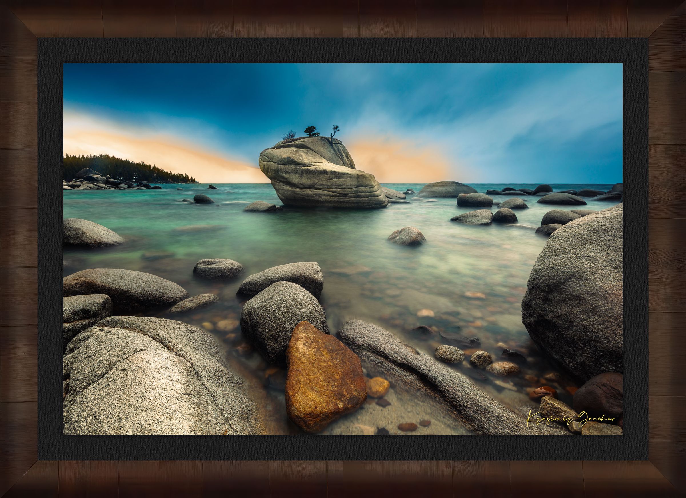 Bonsai Rock formation beside a calm lake in Lake Tahoe during sunset with gentle ripples and clouds. #Finish_Roma Cigar Leaf Frame & Dark Liner