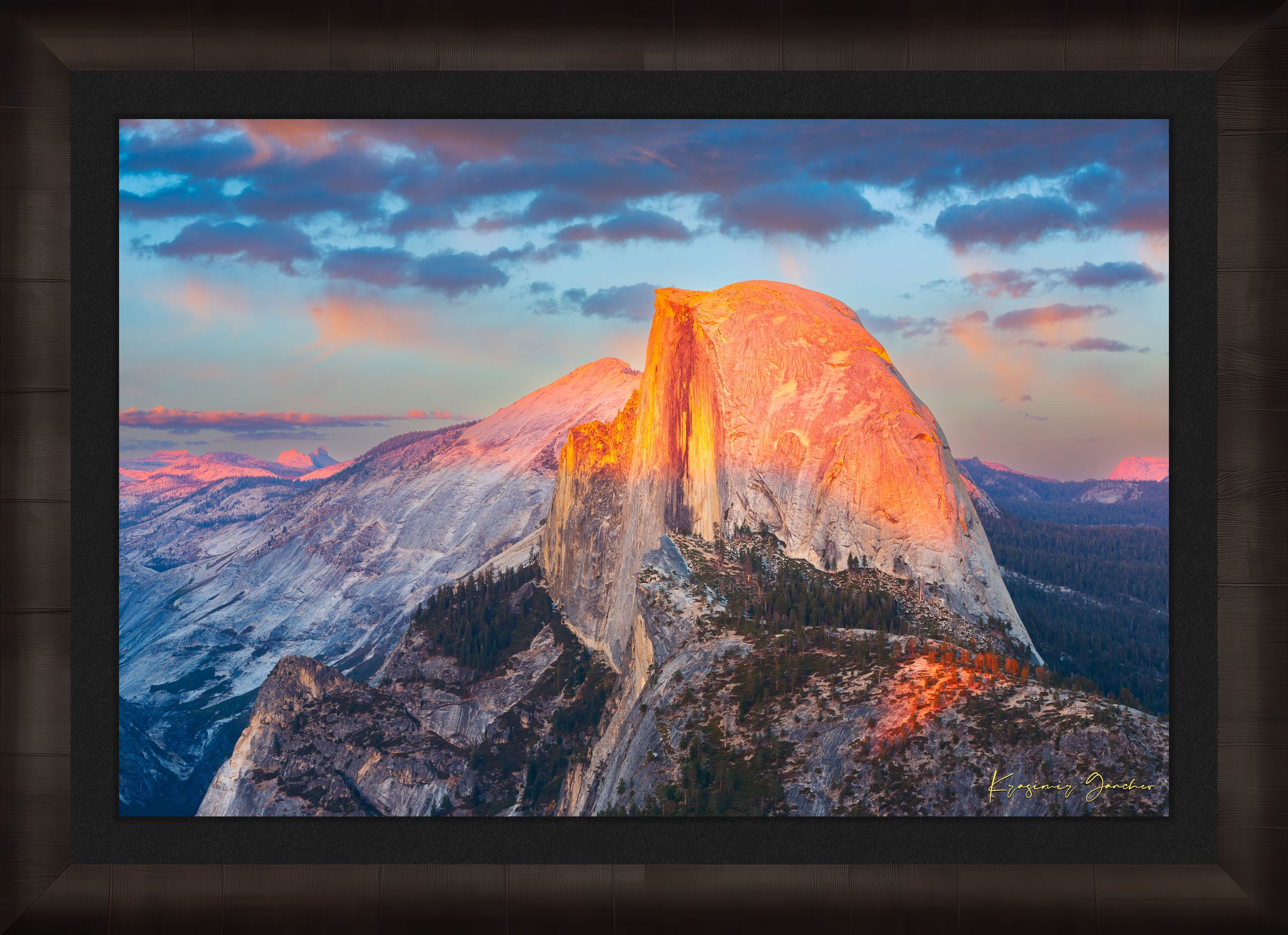 Monolith of Half Dome in Yosemite National Park illuminated by sunset light amid scattered clouds. #Finish_Roma Dark Ash Frame & Dark Liner