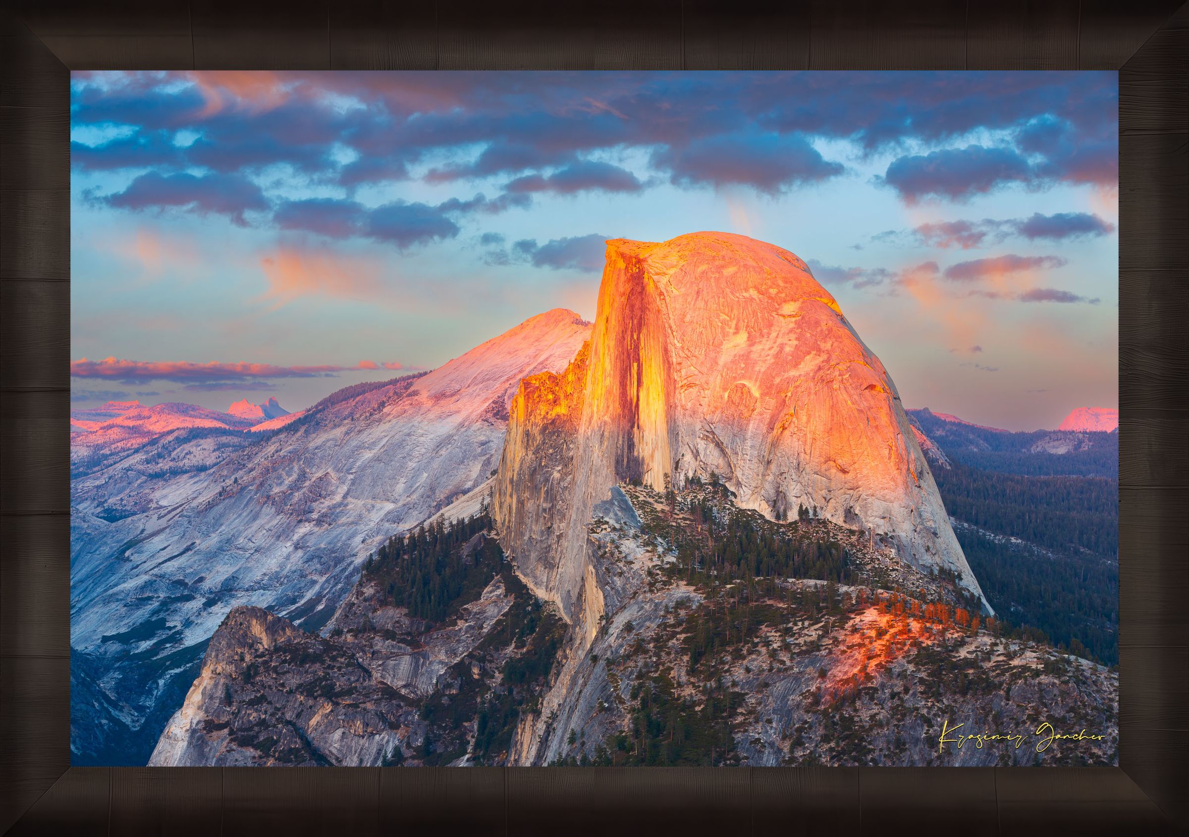 Monolith of Half Dome in Yosemite National Park illuminated by sunset light amid scattered clouds. #Finish_Roma Dark Ash Frame
