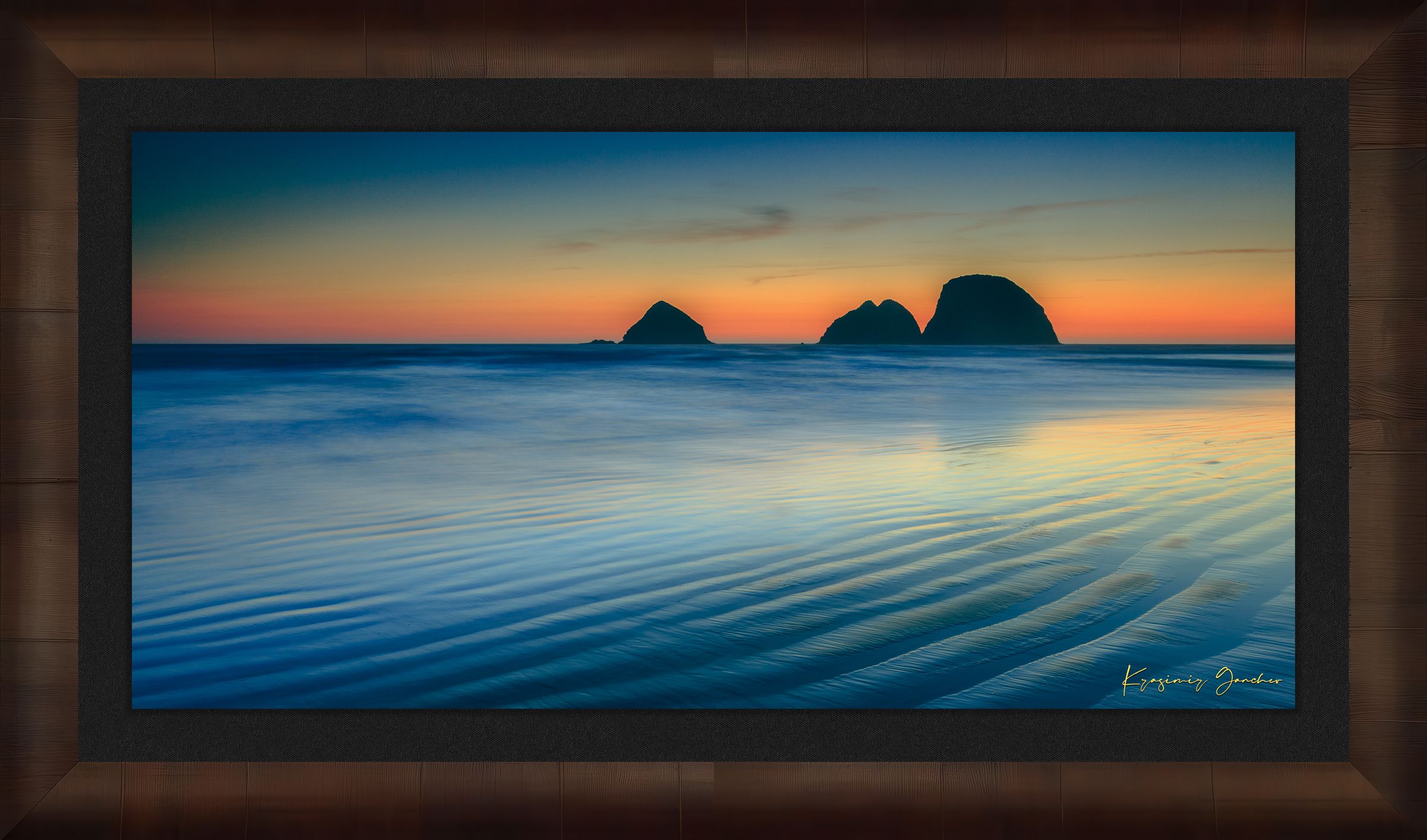 Silhouette of Bird Rock formations against a hazy twilight sky along Canon Beach oceanfront during dusk. #Finish_Roma Cigar Leaf Frame & Dark Liner