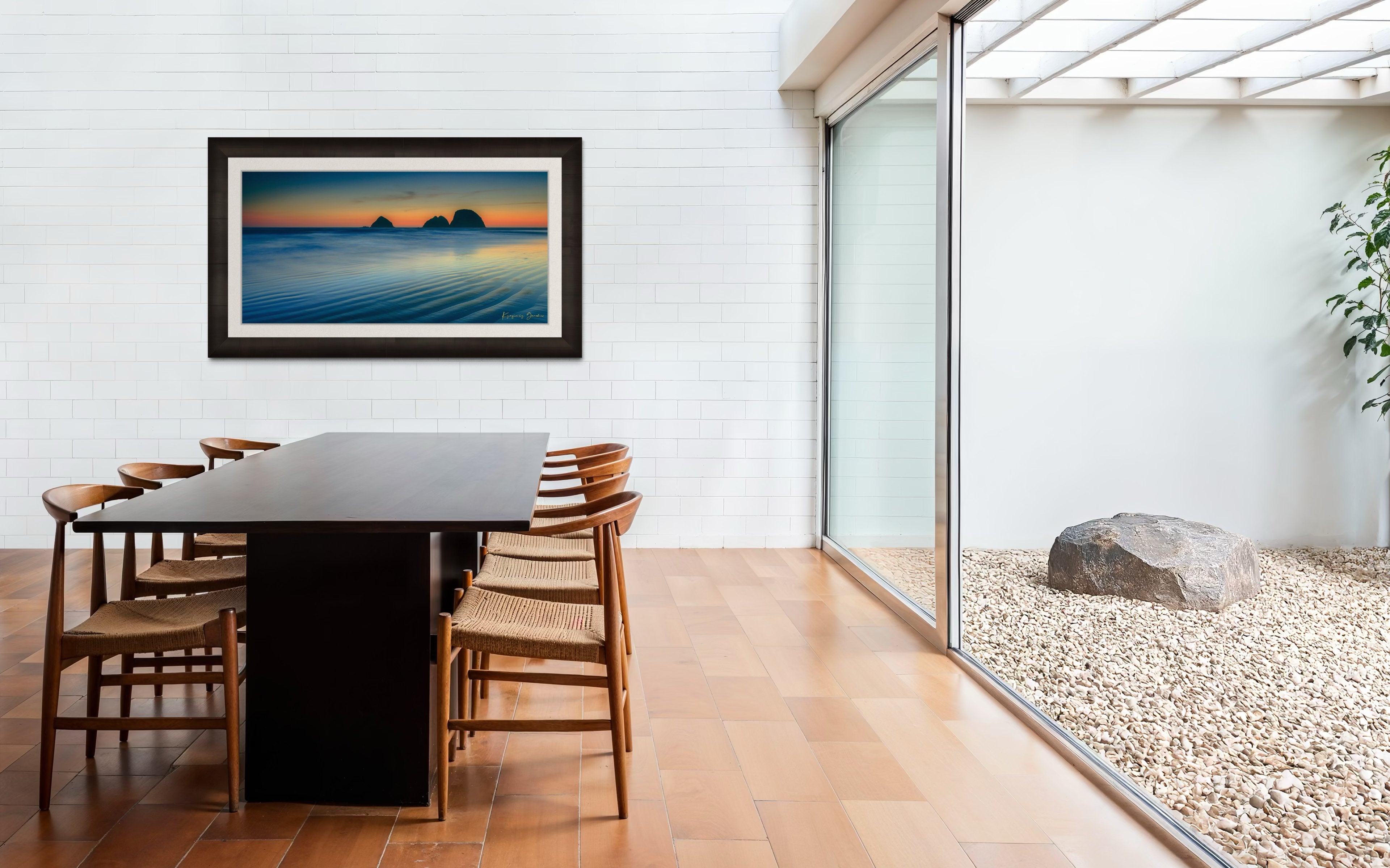 Silhouette of Bird Rock formations against a hazy twilight sky along Canon Beach oceanfront during dusk. #Finish_Roma Dark Ash Frame & Bright Liner