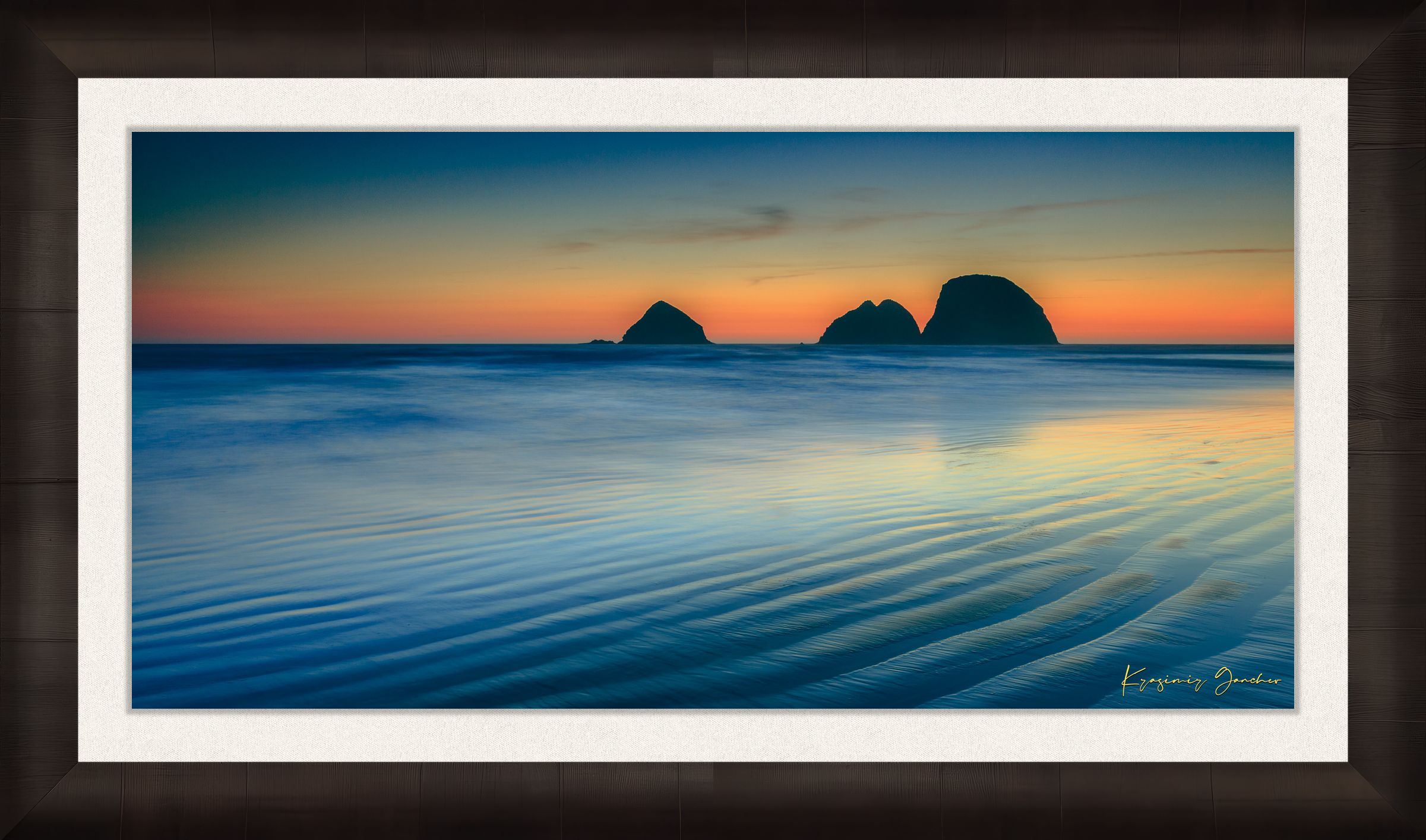 Silhouette of Bird Rock formations against a hazy twilight sky along Canon Beach oceanfront during dusk. #Finish_Roma Dark Ash Frame & Bright Liner
