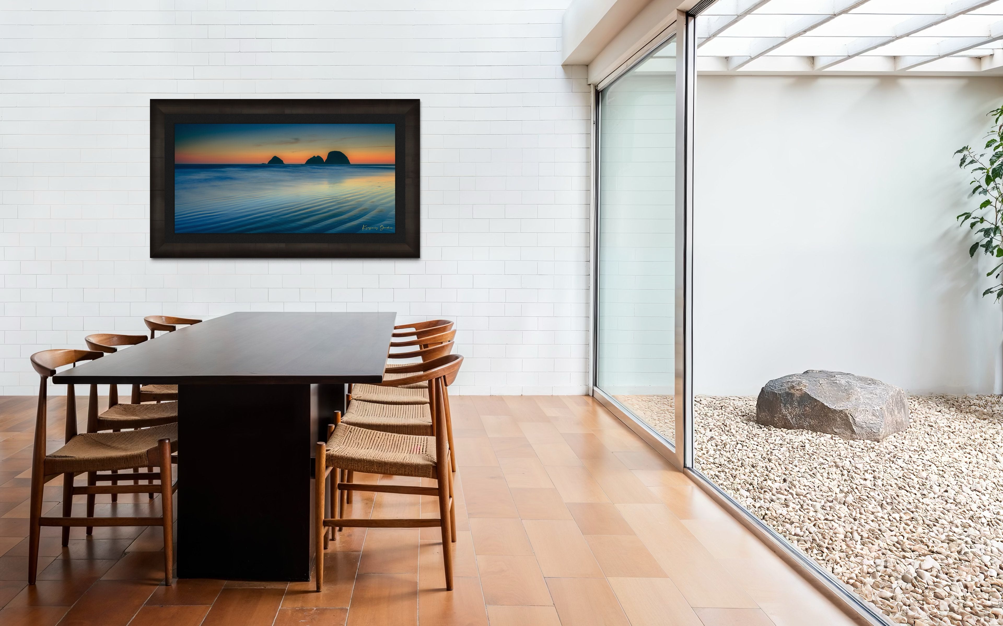 Silhouette of Bird Rock formations against a hazy twilight sky along Canon Beach oceanfront during dusk. #Finish_Roma Dark Ash Frame & Dark Liner