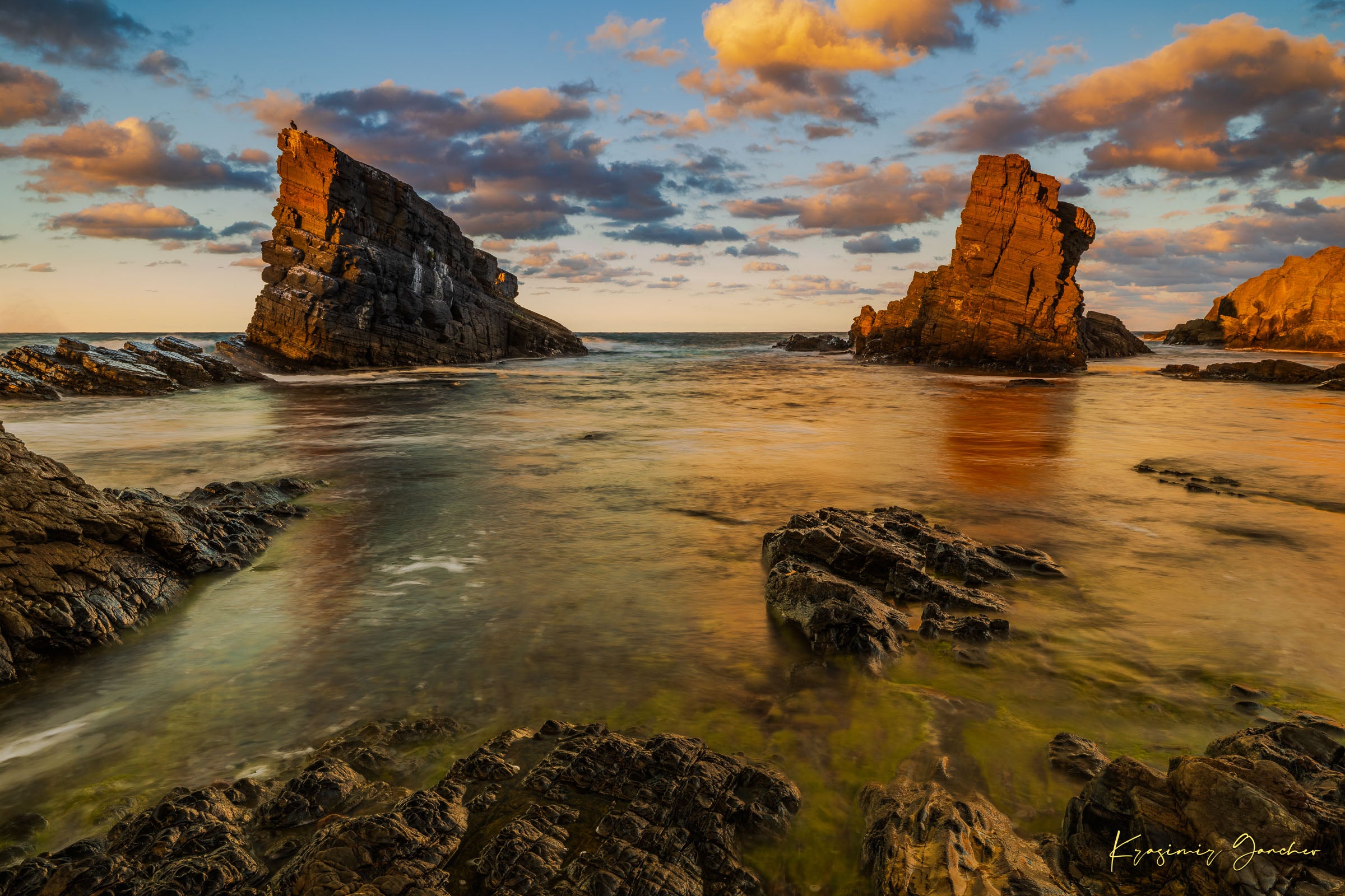 The Stone Ships boulders and sea stacks at Sinemorets, Bulgaria, illuminated by golden sunset light reflecting on calm sea waters. #Finish_Acrylic Recess