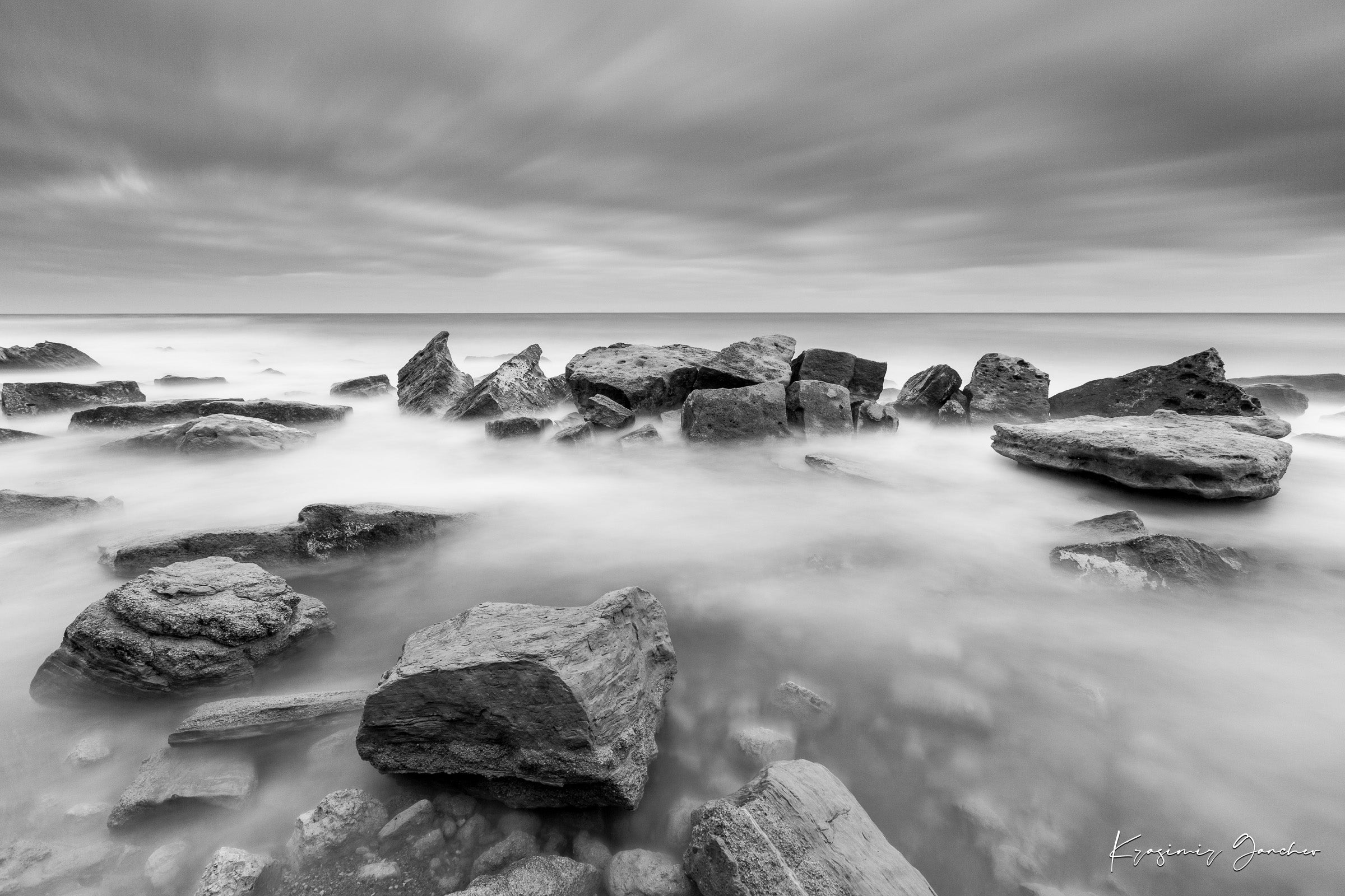 Coastal rock and sand landscape at Fichoza, Bulgaria captured in monochrome during daylight under cloudy skies. #Finish_Acrylic Recess