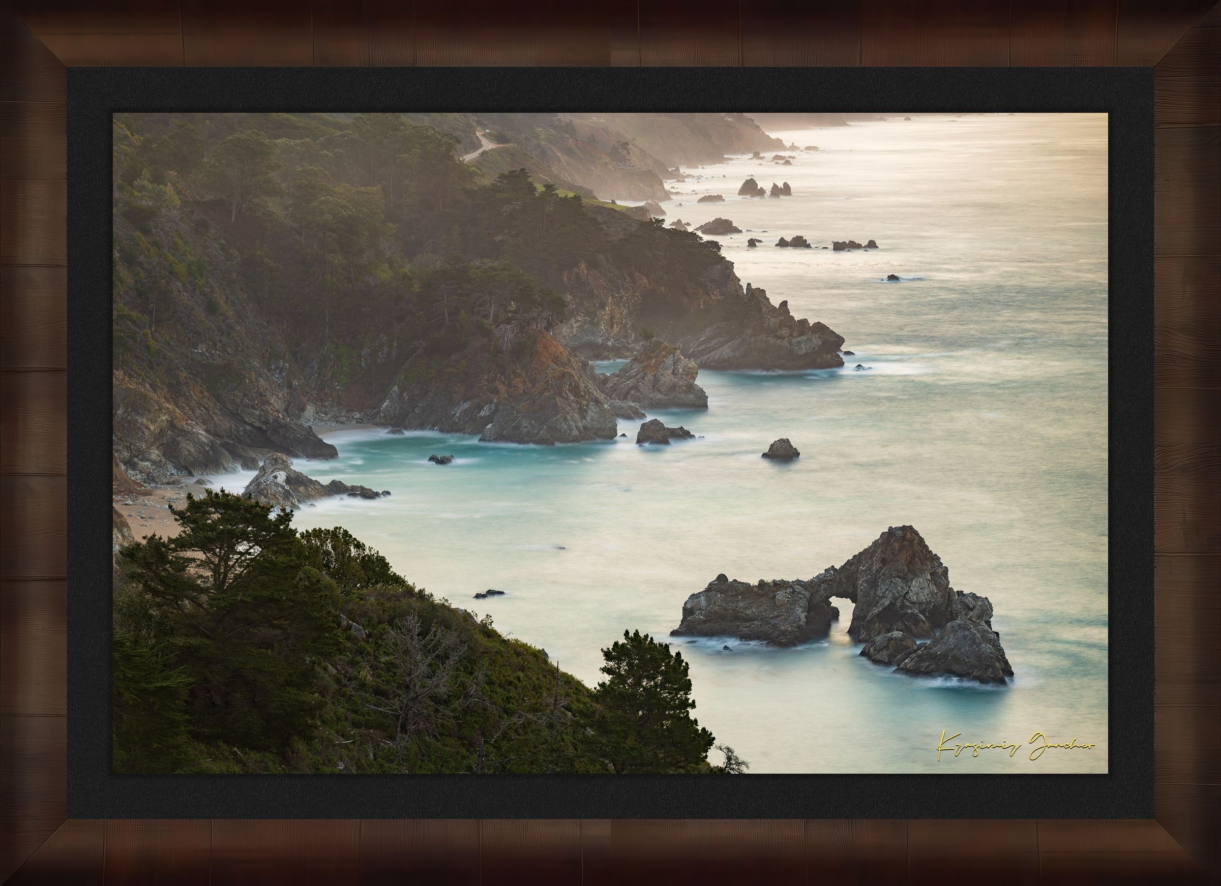 Coastal rock formation known as McWay Rocks at dawn on the Big Sur coastline with lush vegetation and ocean view. #Finish_Roma Cigar Leaf Frame & Dark Liner