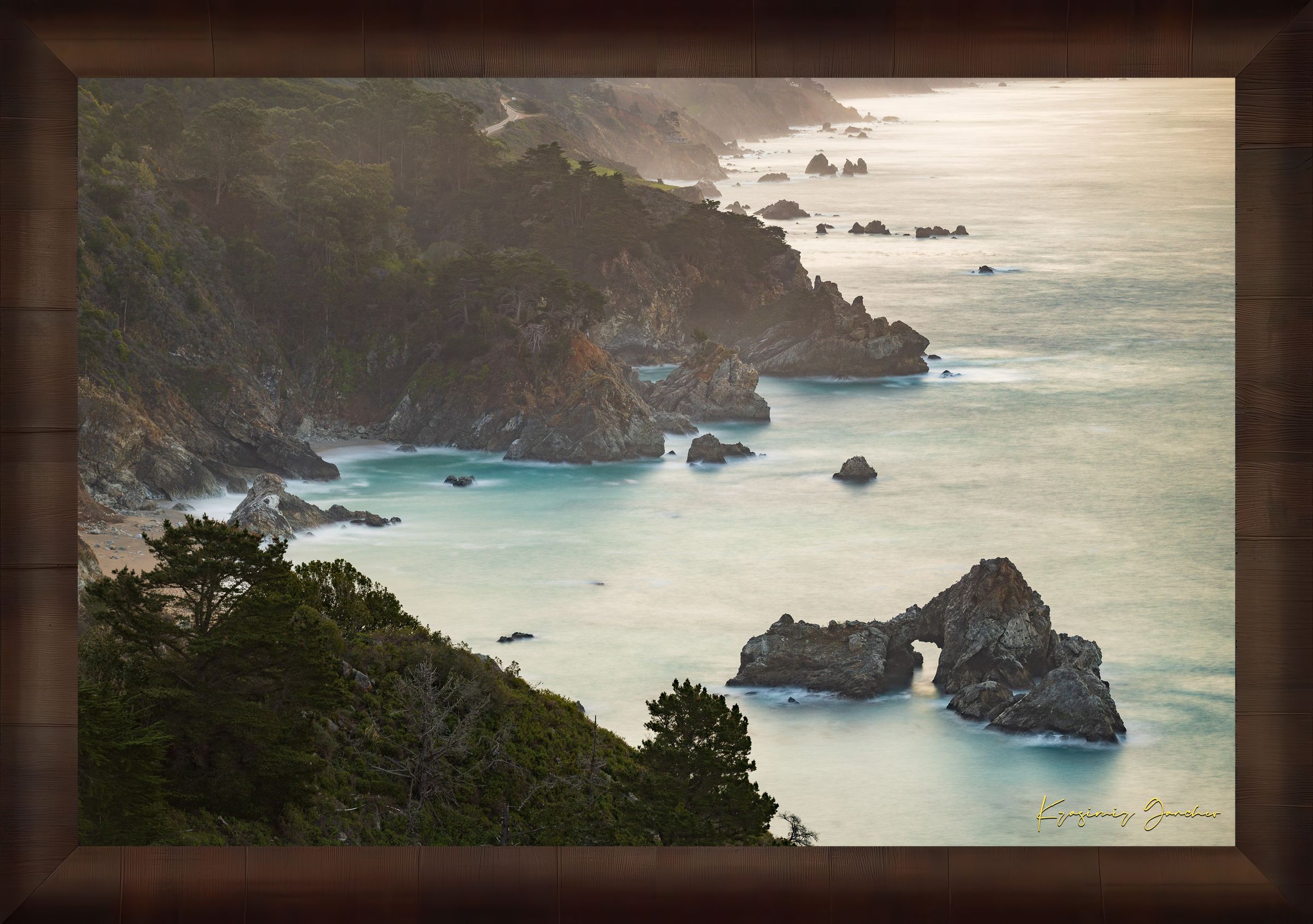 Coastal rock formation known as McWay Rocks at dawn on the Big Sur coastline with lush vegetation and ocean view. #Finish_Roma Cigar Leaf Frame
