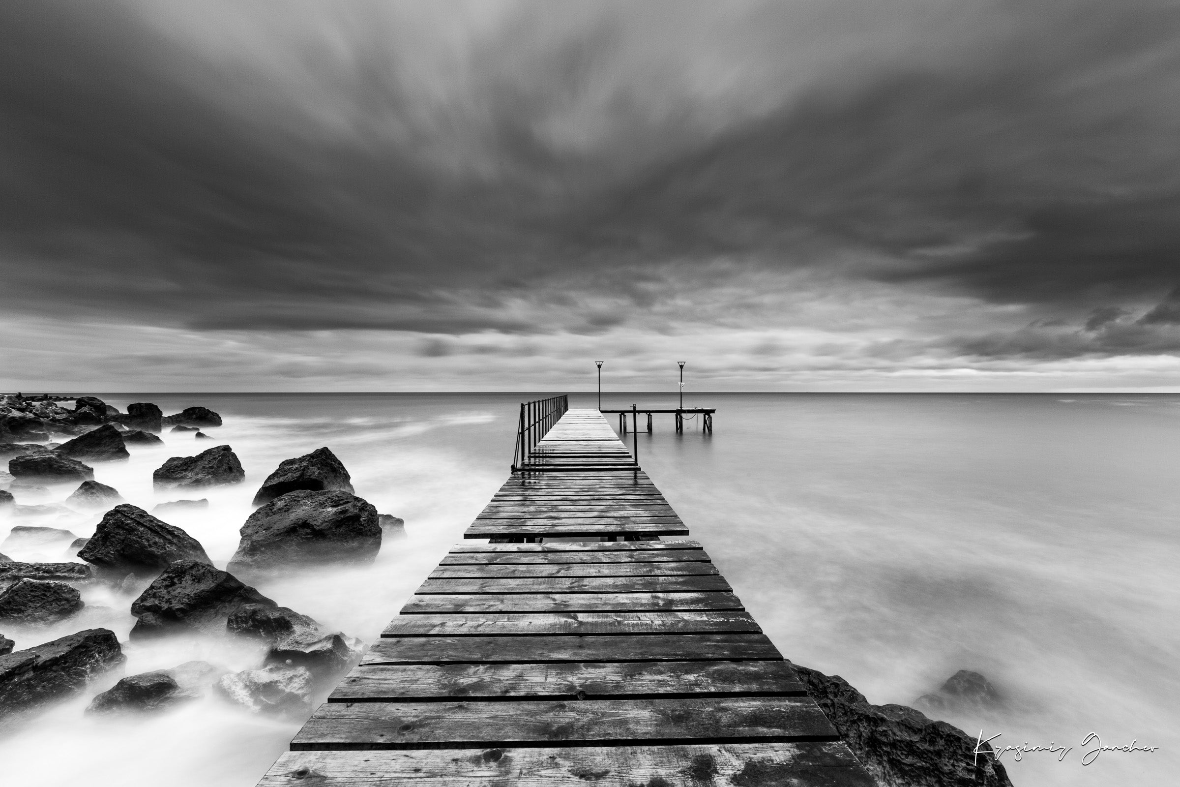 Coastal rocks and pier along the Black Sea coast during storm, wave activity visible. #Finish_Acrylic Recess