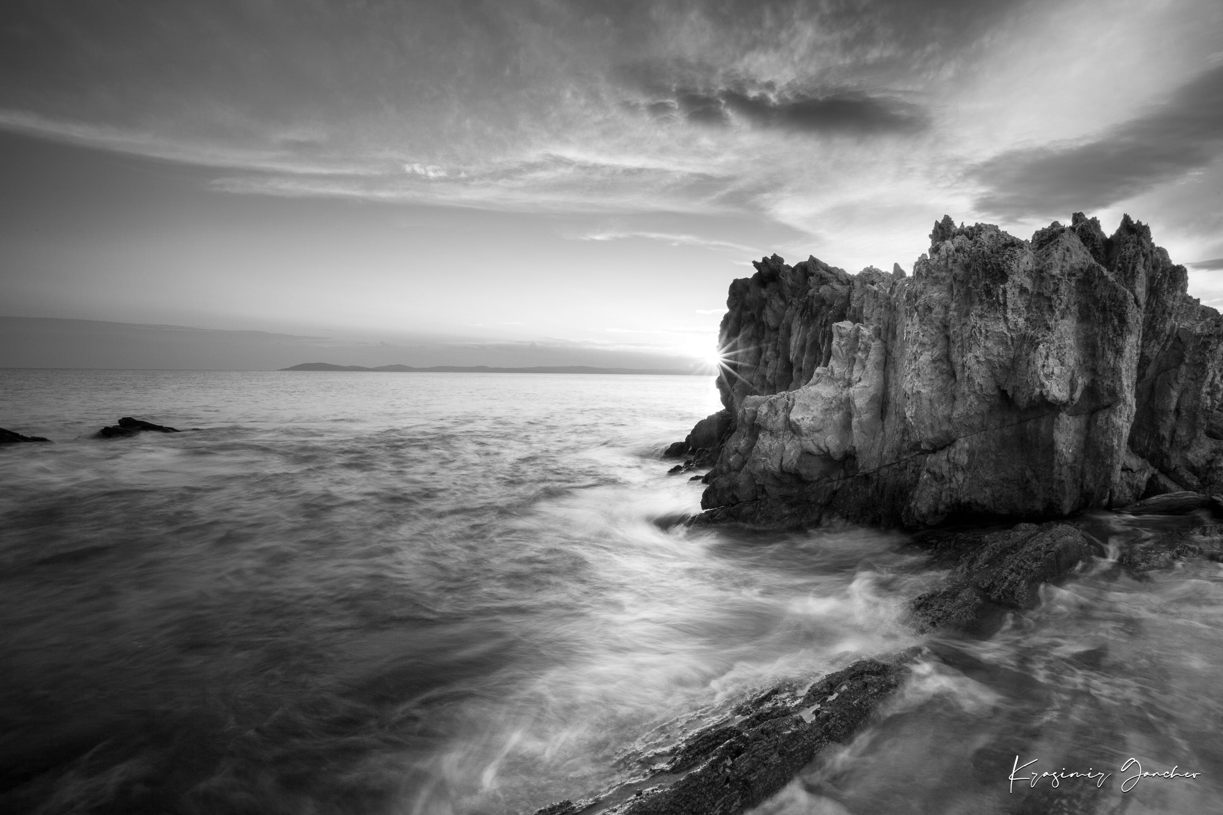 Black and white photograph of Sithonia’s rugged coastal cliffs during sunset, high contrast with breaking waves. #Finish_Acrylic Recess