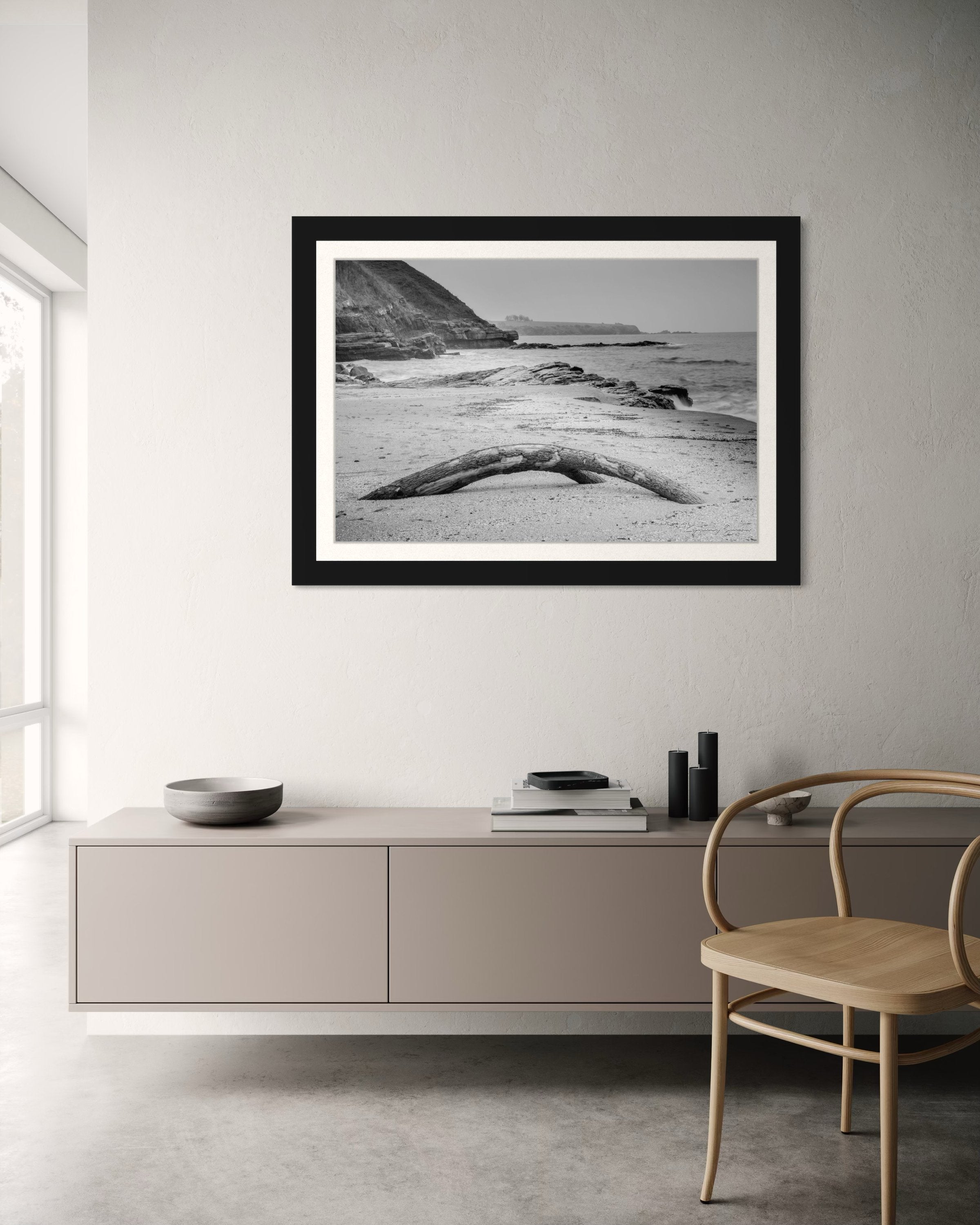 Weathered driftwood on Ahtopol beach along the Black Sea during daylight with haze. #Finish_Roma Satin Black Frame & Bright Liner