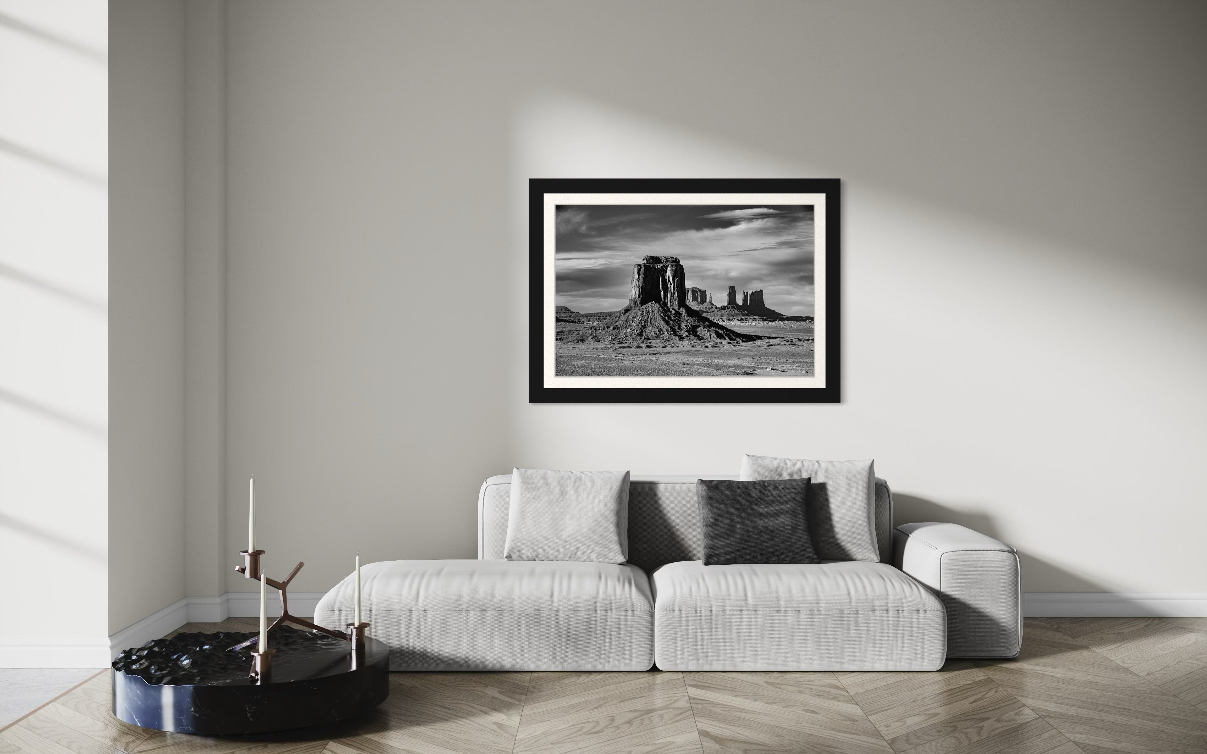 Timeless black and white landscape of Monument Valley's towering formations under dawn skies with soft cloud cover. #Finish_Roma Satin Black Frame & Bright Liner