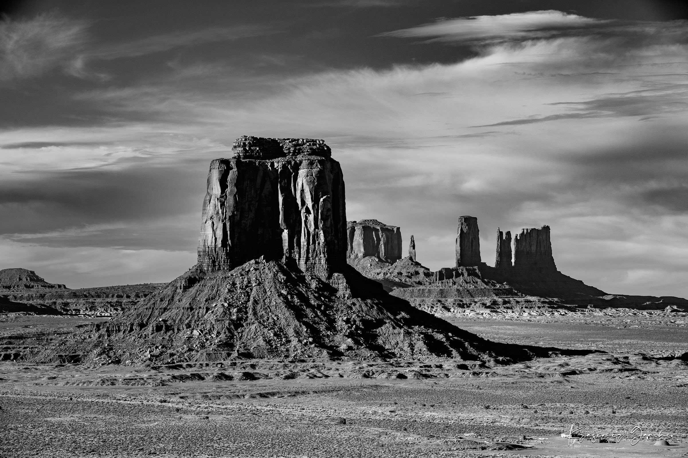 Timeless black and white landscape of Monument Valley's towering formations under dawn skies with soft cloud cover. #Finish_Acrylic Recess
