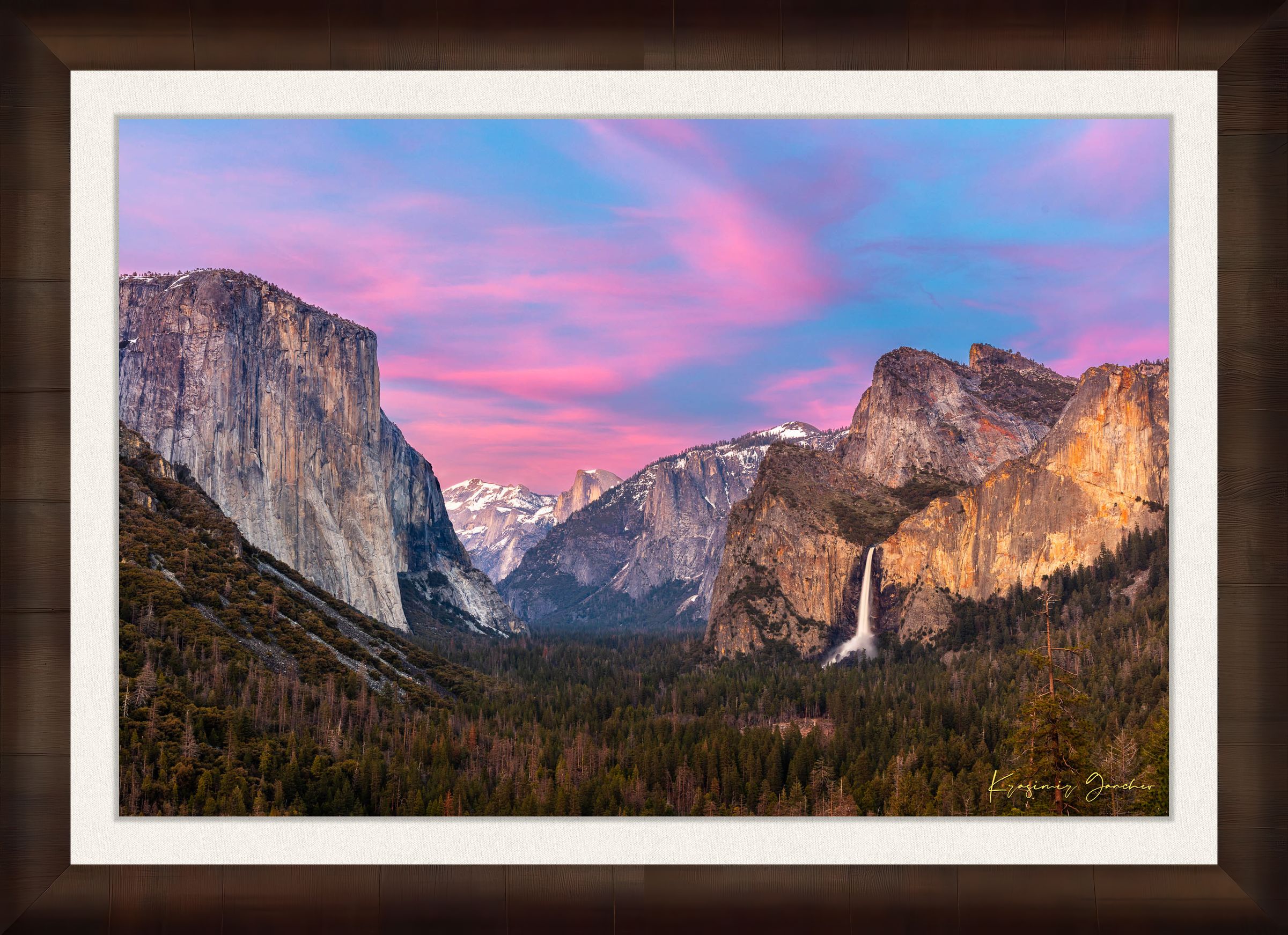 Yosemite Valley view of El Capitan monolith beneath snowy peaks, soft rose-lavender sky and cloud-covered horizon. #Finish_Roma Cigar Leaf Frame & Bright Liner
