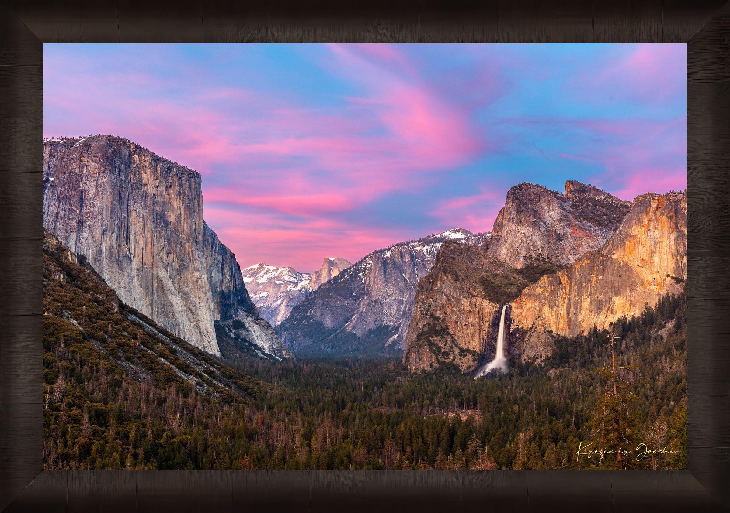 Yosemite Valley view of El Capitan monolith beneath snowy peaks, soft rose-lavender sky and cloud-covered horizon. #Finish_Roma Dark Ash Frame