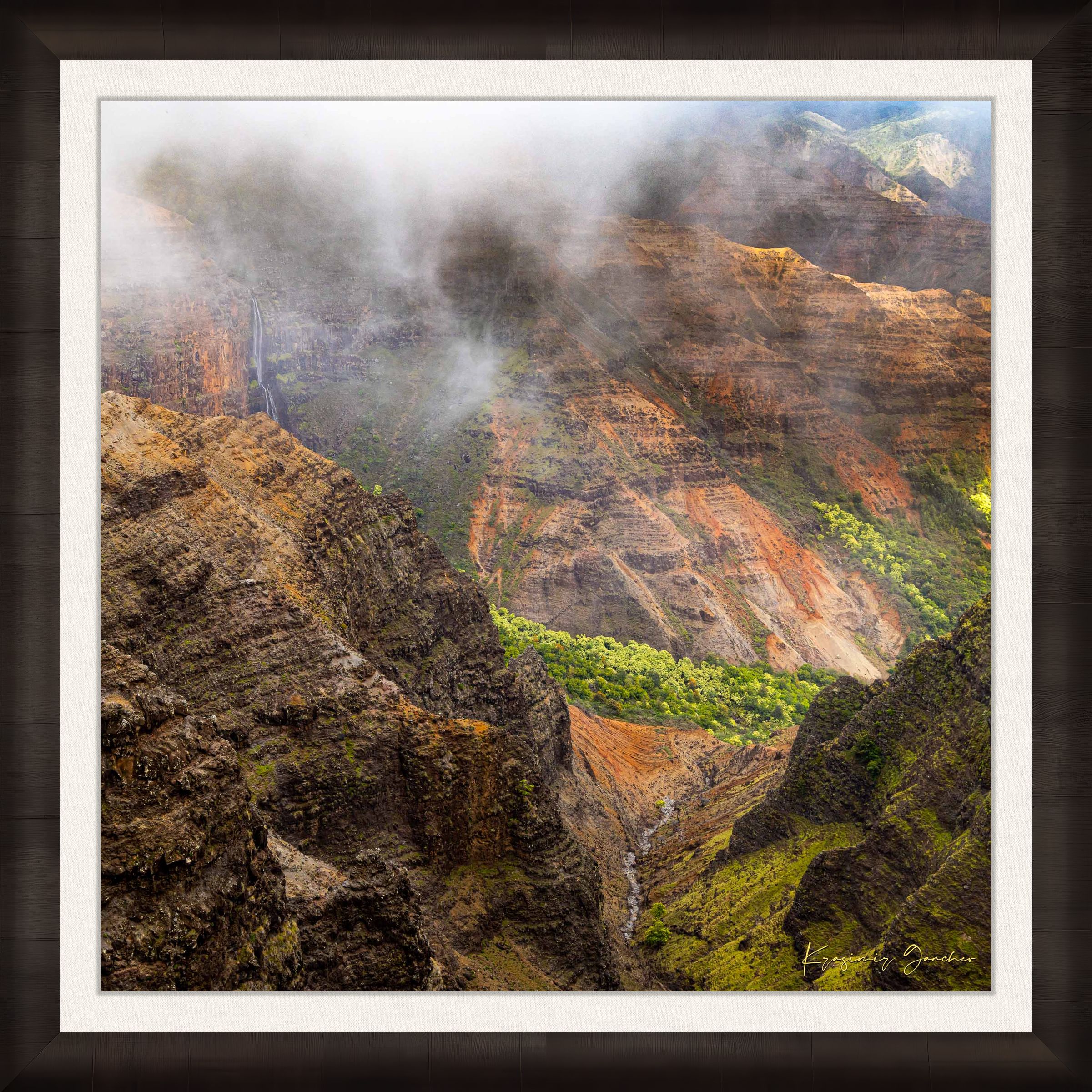 Waterfall descending into Waimea Canyon on Kauai, mist rising through dense foliage in foggy conditions. #Finish_Roma Dark Ash Frame & Bright Liner