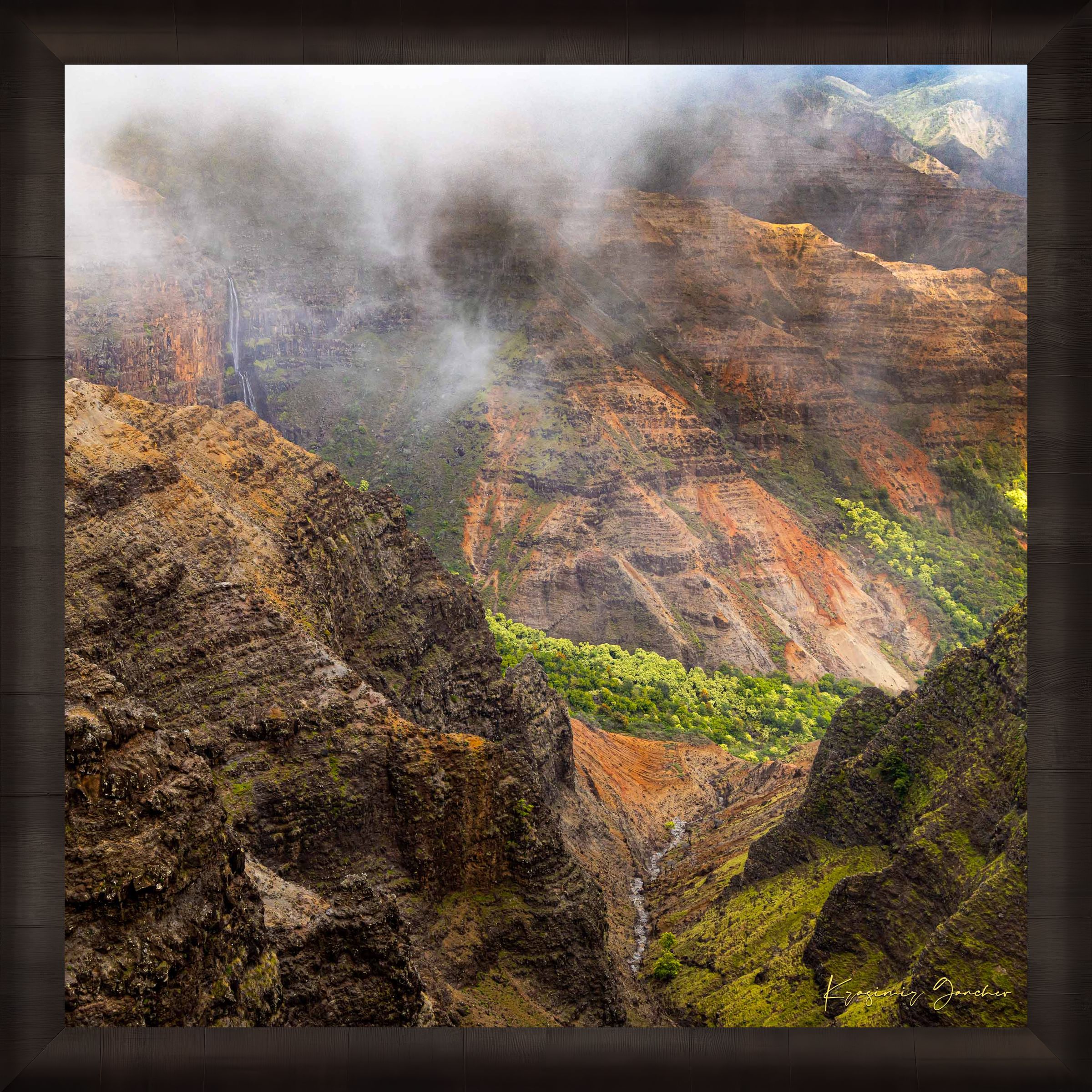 Waterfall descending into Waimea Canyon on Kauai, mist rising through dense foliage in foggy conditions. #Finish_Roma Dark Ash Frame