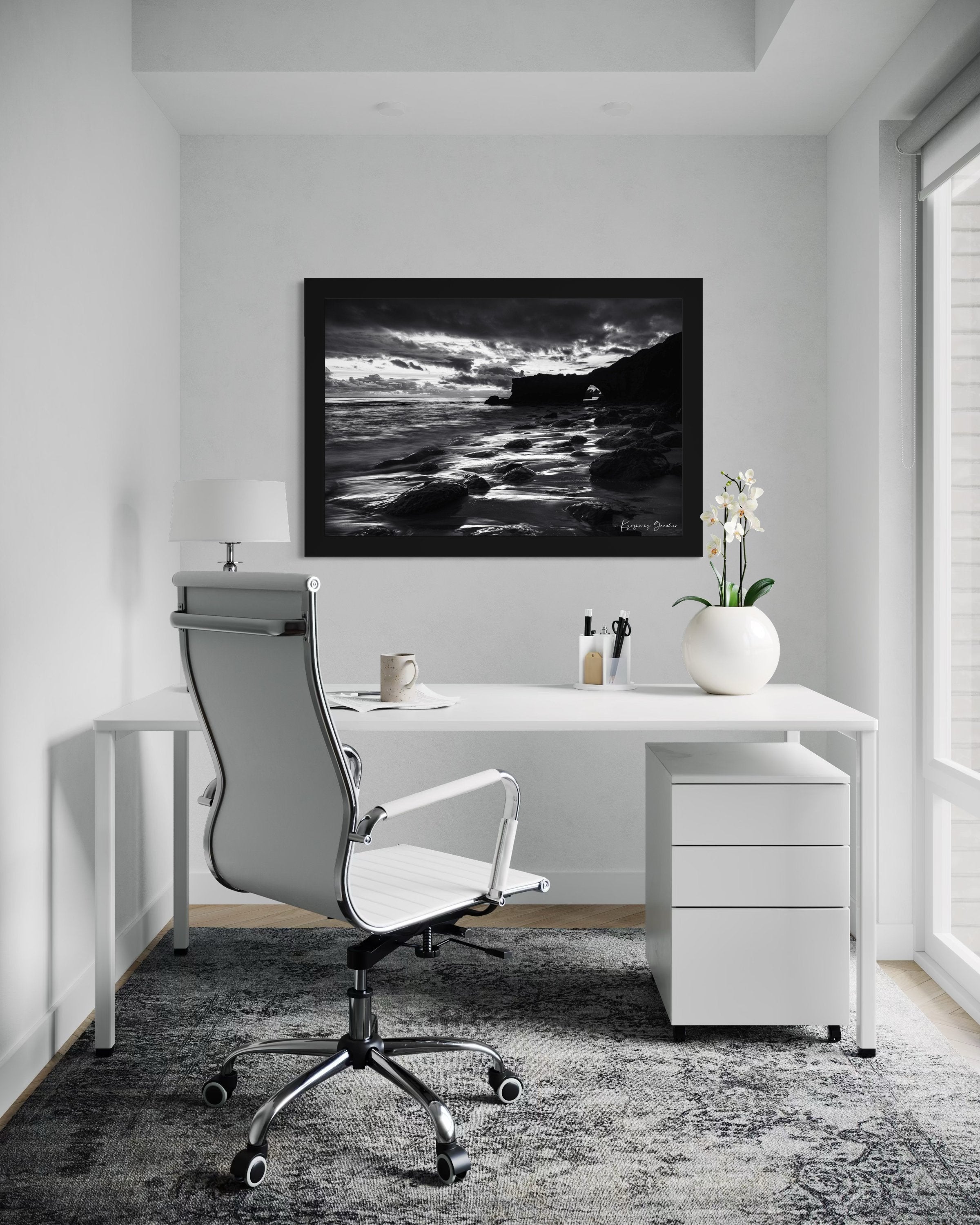 Black-and-white photograph showcasing a rock arch at Santa Cruz’s coastline during sunset with flowing waves. #Finish_Roma Satin Black Frame