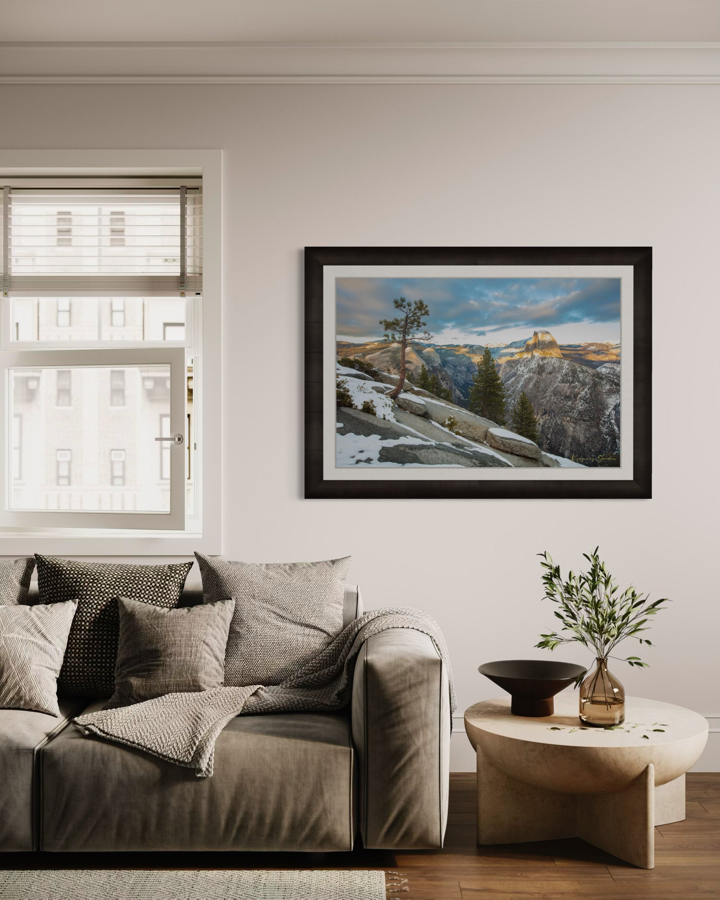 Majestic Half Dome in Yosemite National Park bathed in golden sunset light, covered in snow with wisps of cloud moving across the sky. #Finish_Roma Dark Ash Frame & Bright Liner