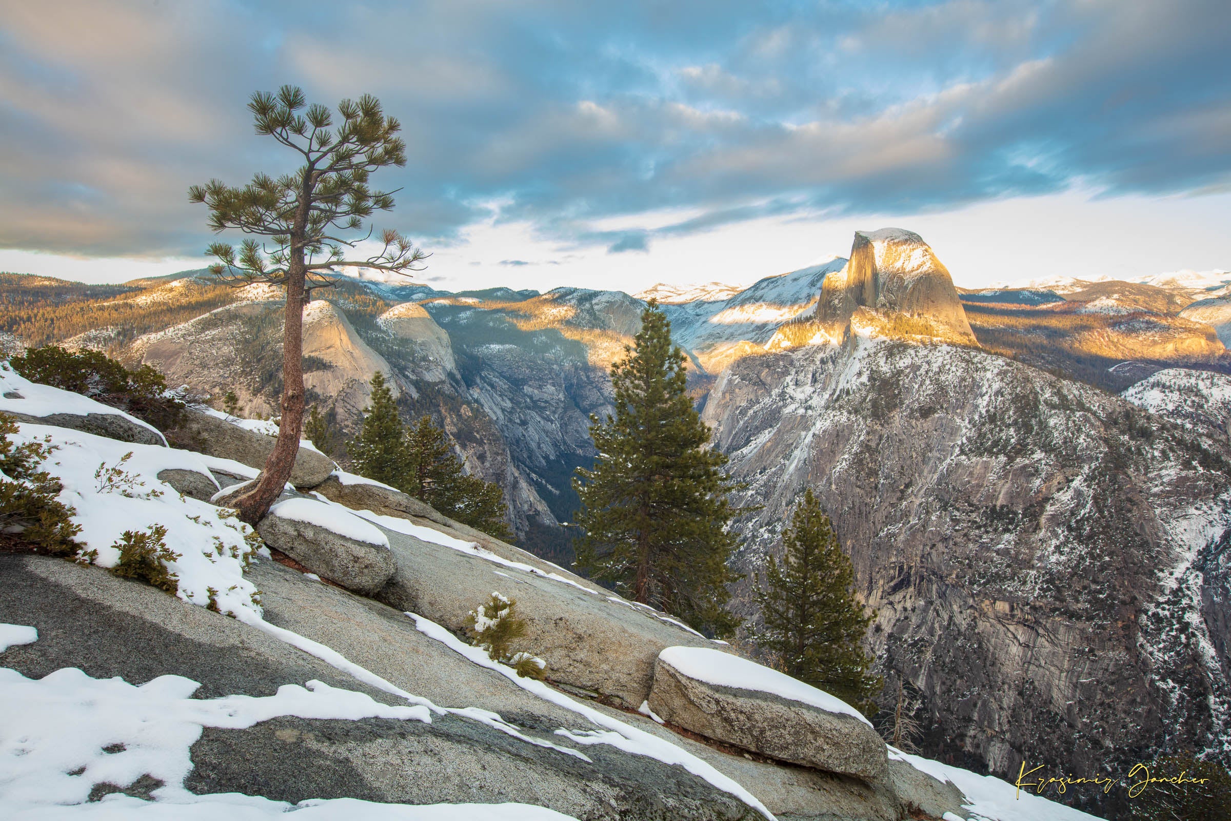 Majestic Half Dome in Yosemite National Park bathed in golden sunset light, covered in snow with wisps of cloud moving across the sky. #Finish_Acrylic Recess