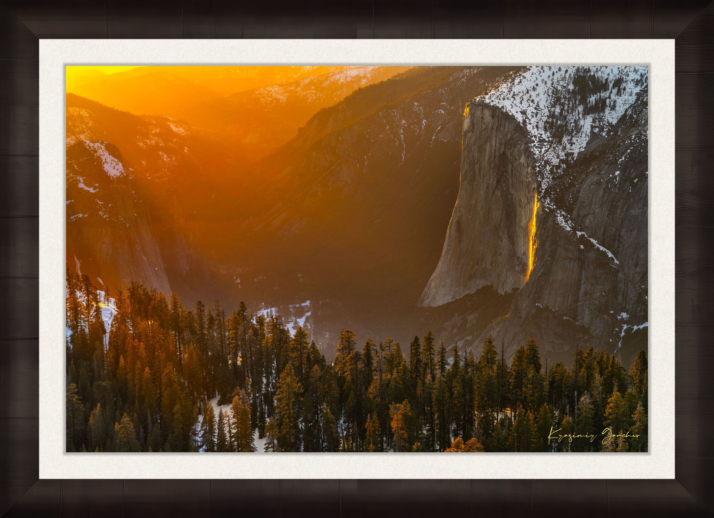 El Capitan illuminated by firefall light as a waterfall glows orange in Yosemite Valley. #Finish_Roma Dark Ash Frame & Bright Liner