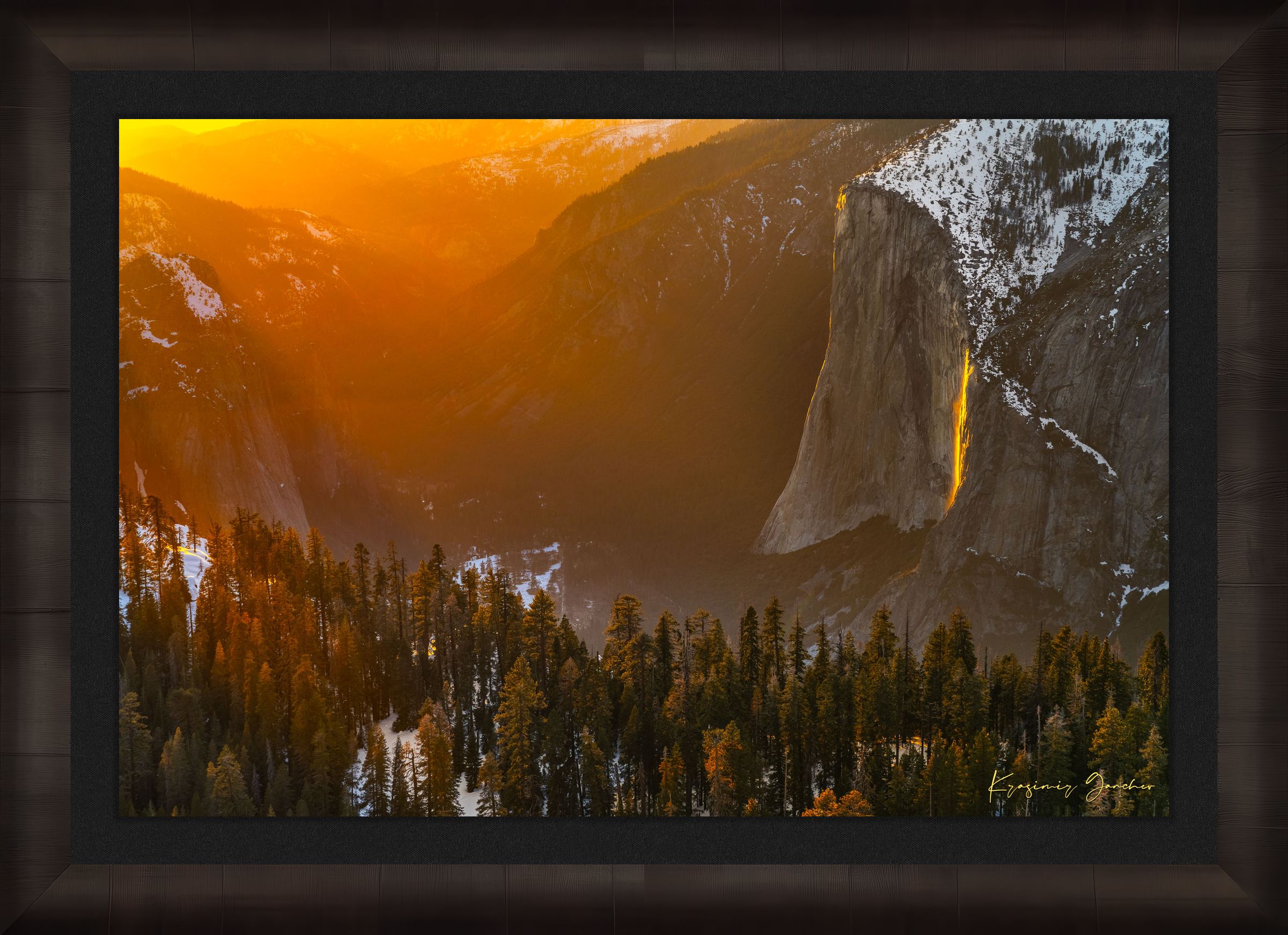 El Capitan illuminated by firefall light as a waterfall glows orange in Yosemite Valley. #Finish_Roma Dark Ash Frame & Dark Liner