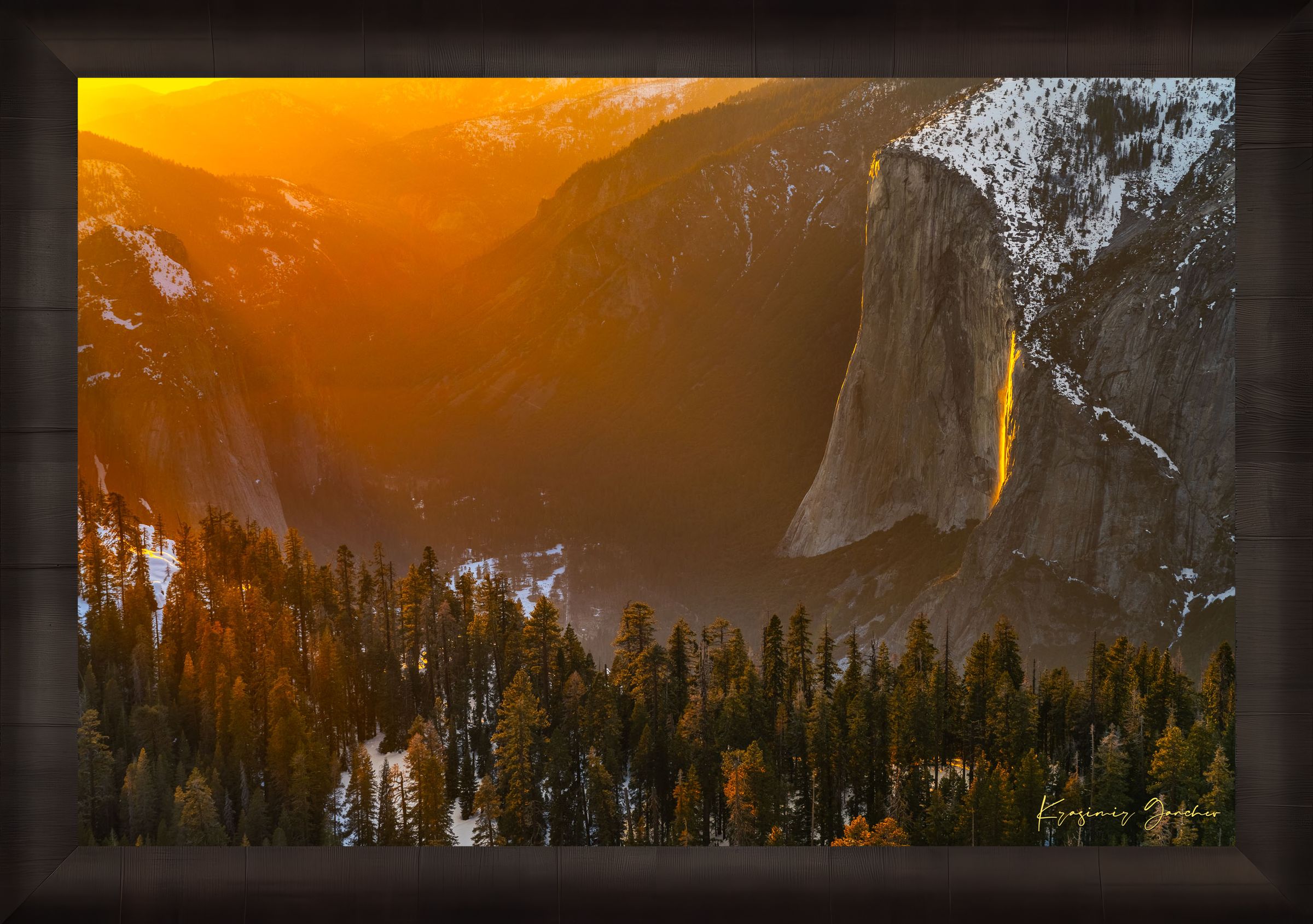 El Capitan illuminated by firefall light as a waterfall glows orange in Yosemite Valley. #Finish_Roma Dark Ash Frame